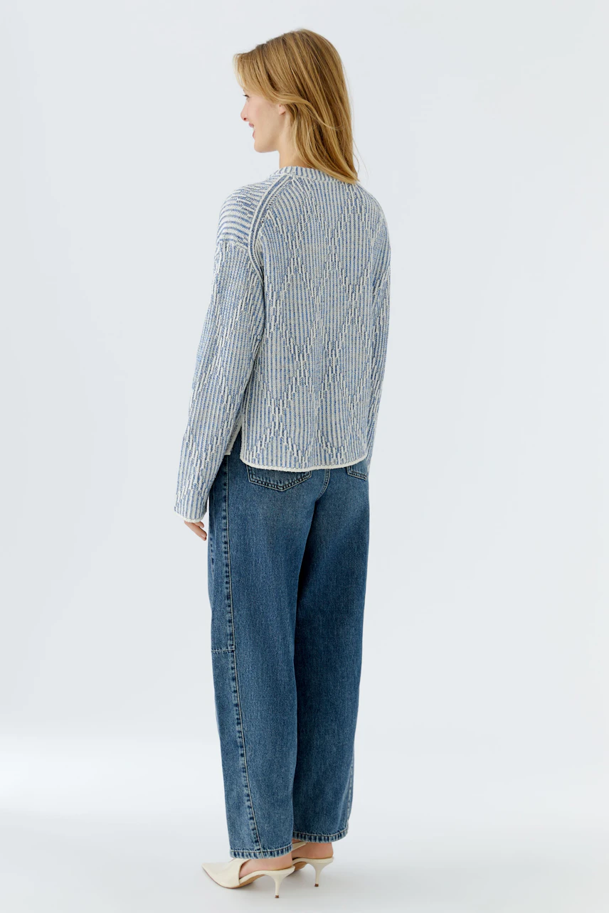 Casual women's pullover: A woman in a striped pullover with a relaxed fit and back view.