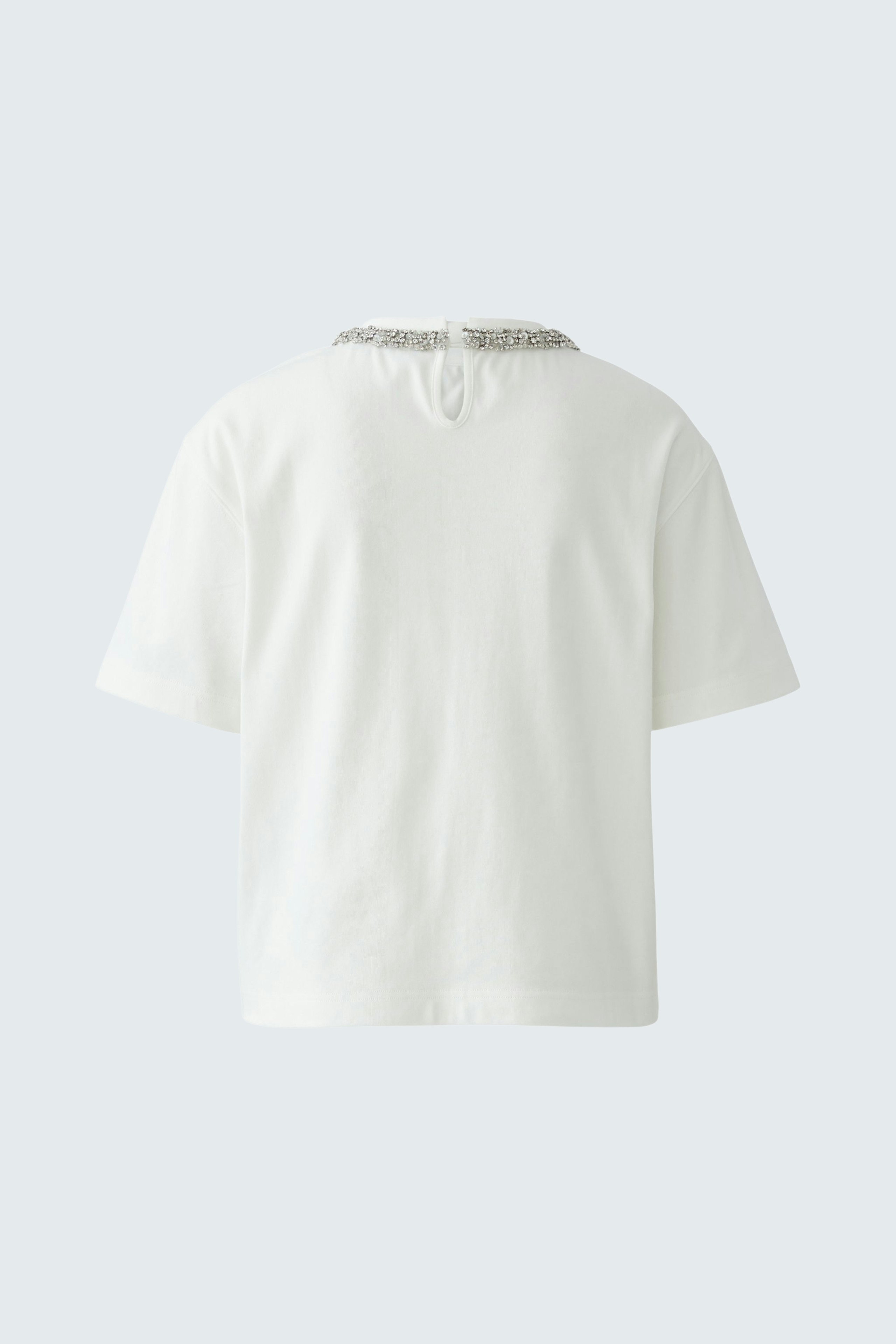 Casual women's T-shirt: A simple white tee with a relaxed fit and back detail.