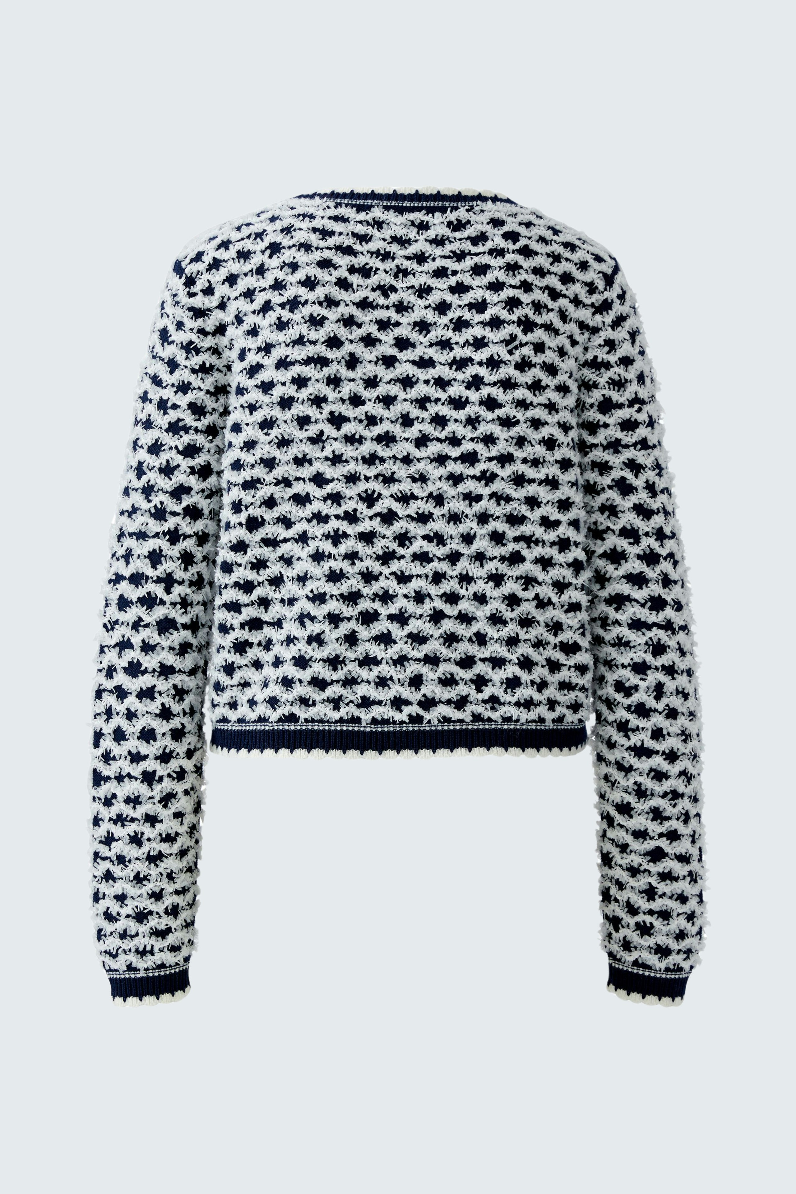 Casual women's pullover: Back view of a navy and white patterned pullover with a relaxed fit.