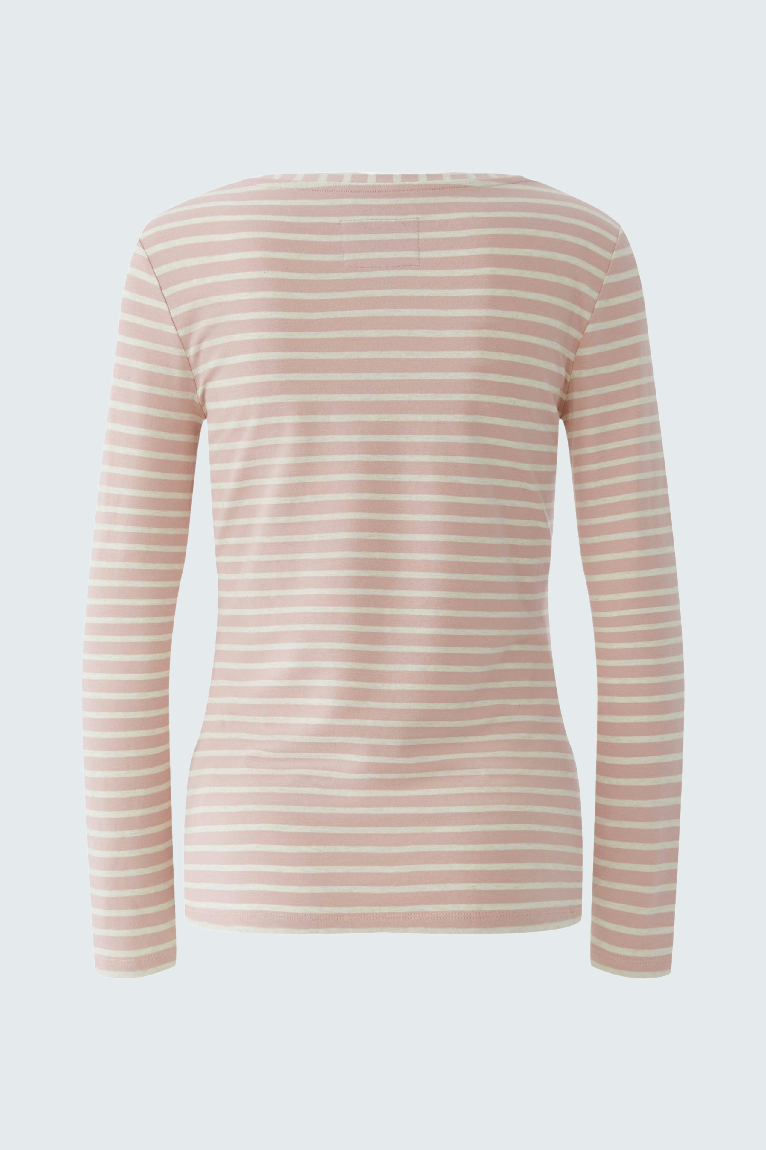 Casual long-sleeve shirt: A woman in a pink striped pullover, showcasing a relaxed fit and comfortable style.