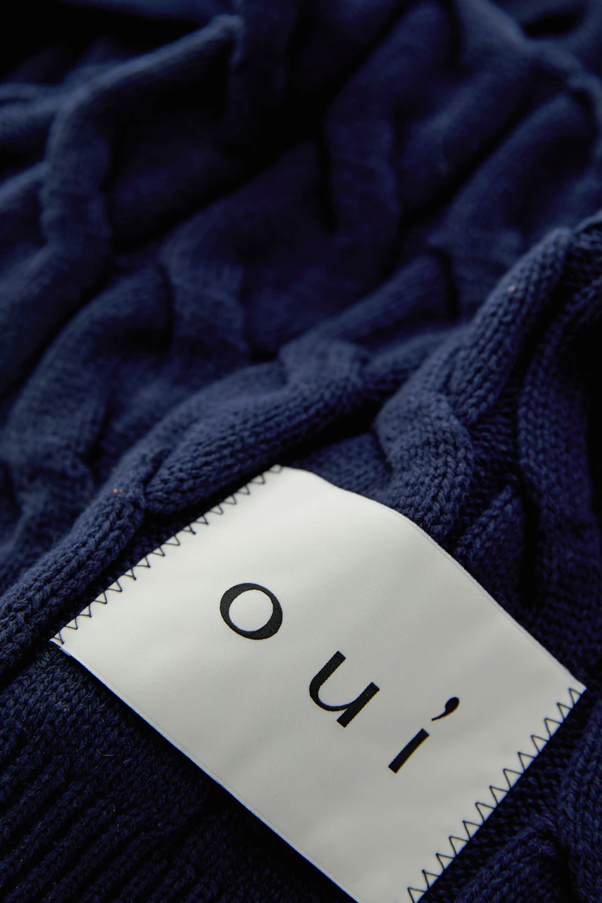 Cozy women's scarf in navy blue with a textured pattern, perfect for casual outfits.