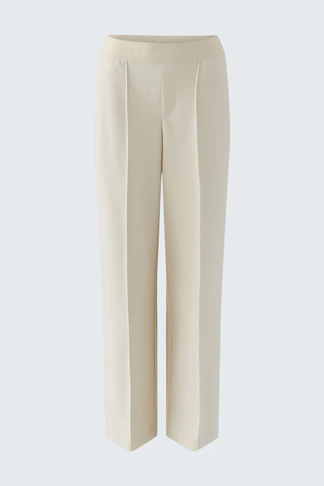 Casual women's trousers in light beige with a relaxed fit and wide legs.