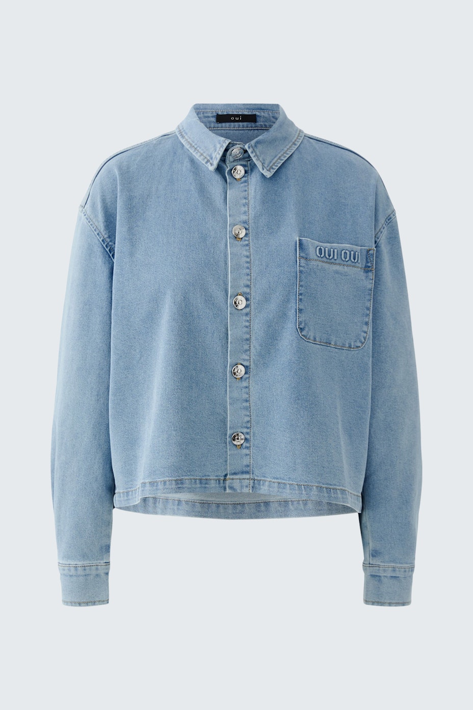Casual women's blouse: Light blue denim blouse with a button-up front and a chest pocket.