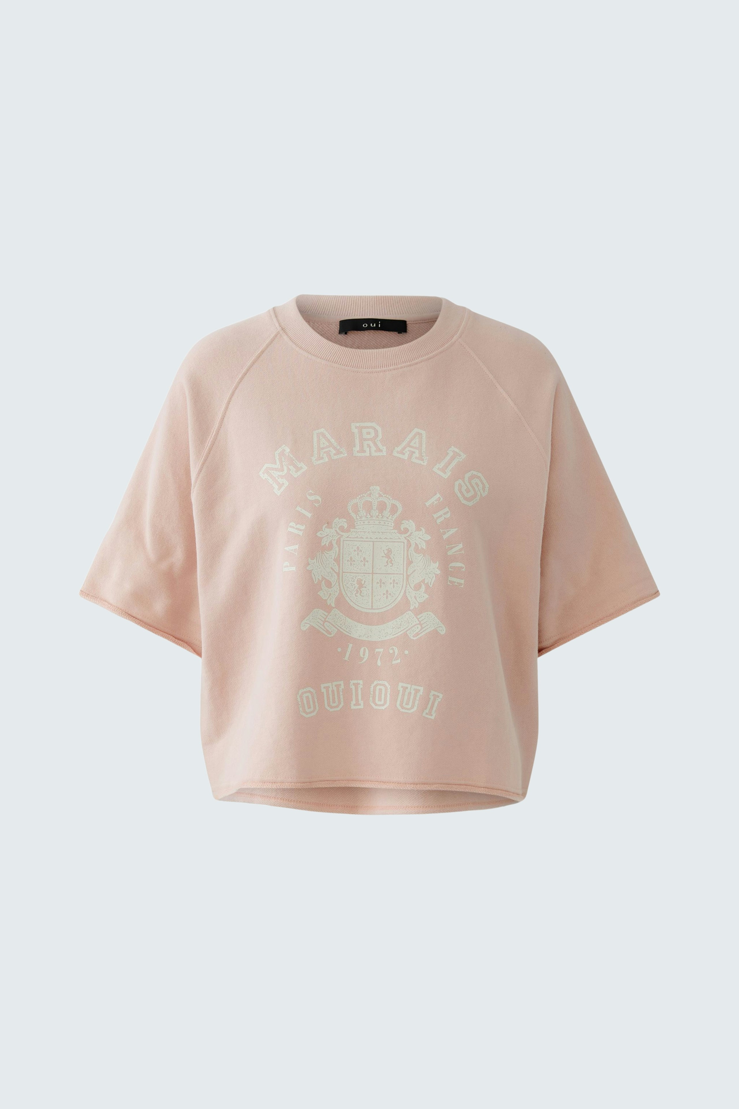 Casual women's pullover: Light pink cropped sweatshirt with a graphic print, perfect for everyday wear.