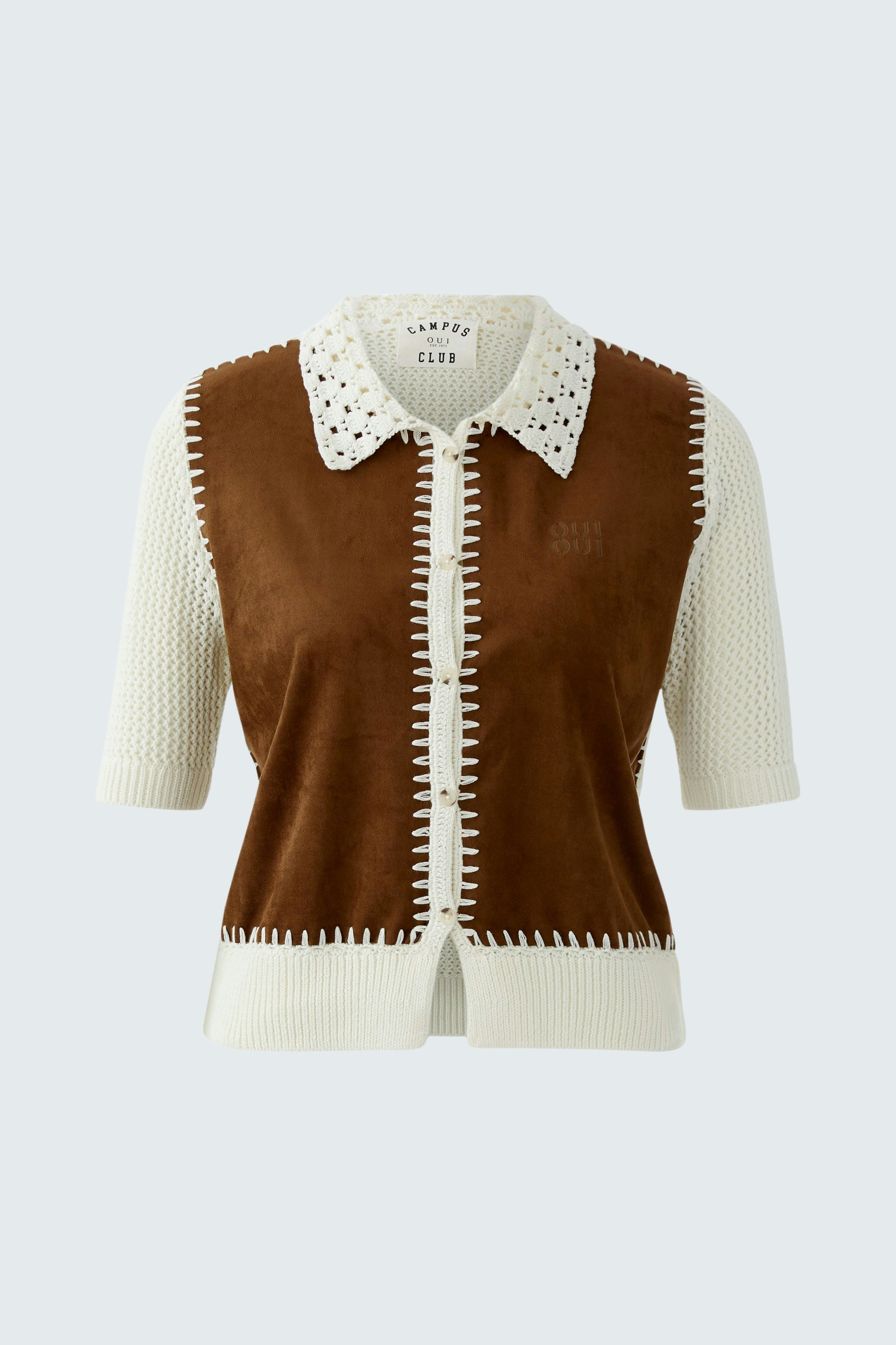 Casual women's cardigan: A woman in a brown and cream short-sleeve cardigan with a collar.