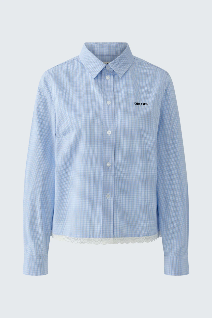 Casual women's shirt: Light blue button-up shirt with a relaxed fit and subtle logo detail.