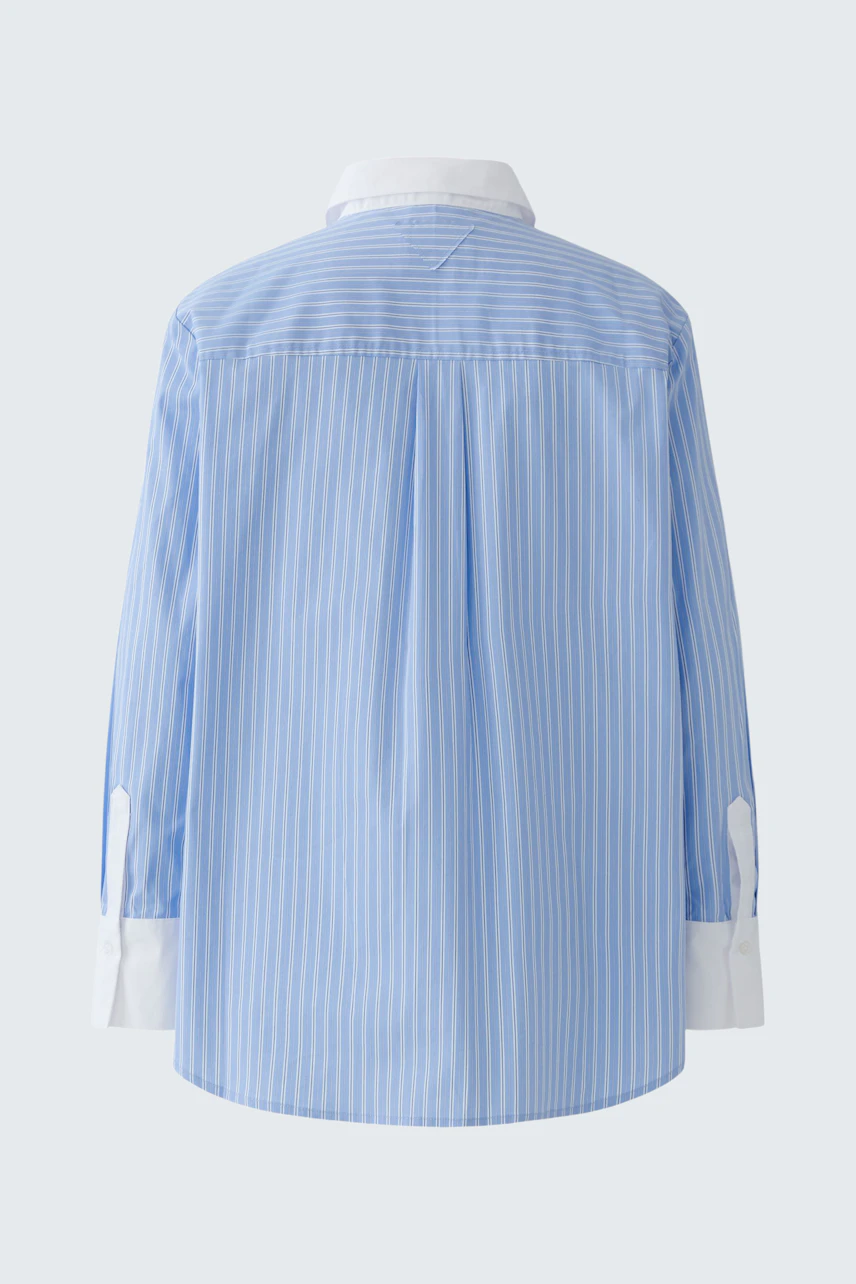Casual women's blouse: Blue striped shirt with a relaxed fit and white collar, perfect for everyday wear.