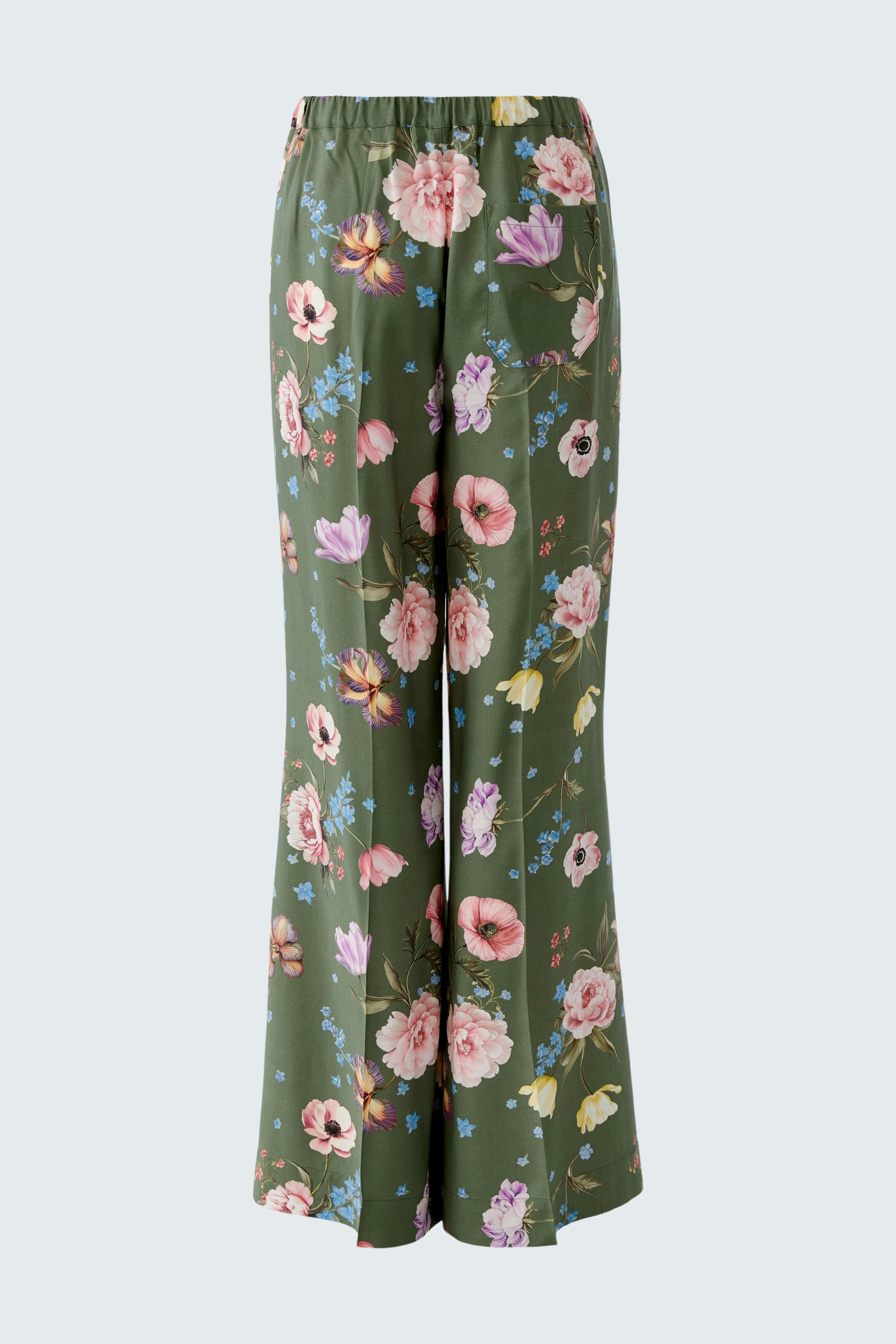 Floral women's pants in green with a relaxed fit, featuring an elastic waistband and vibrant flower patterns.