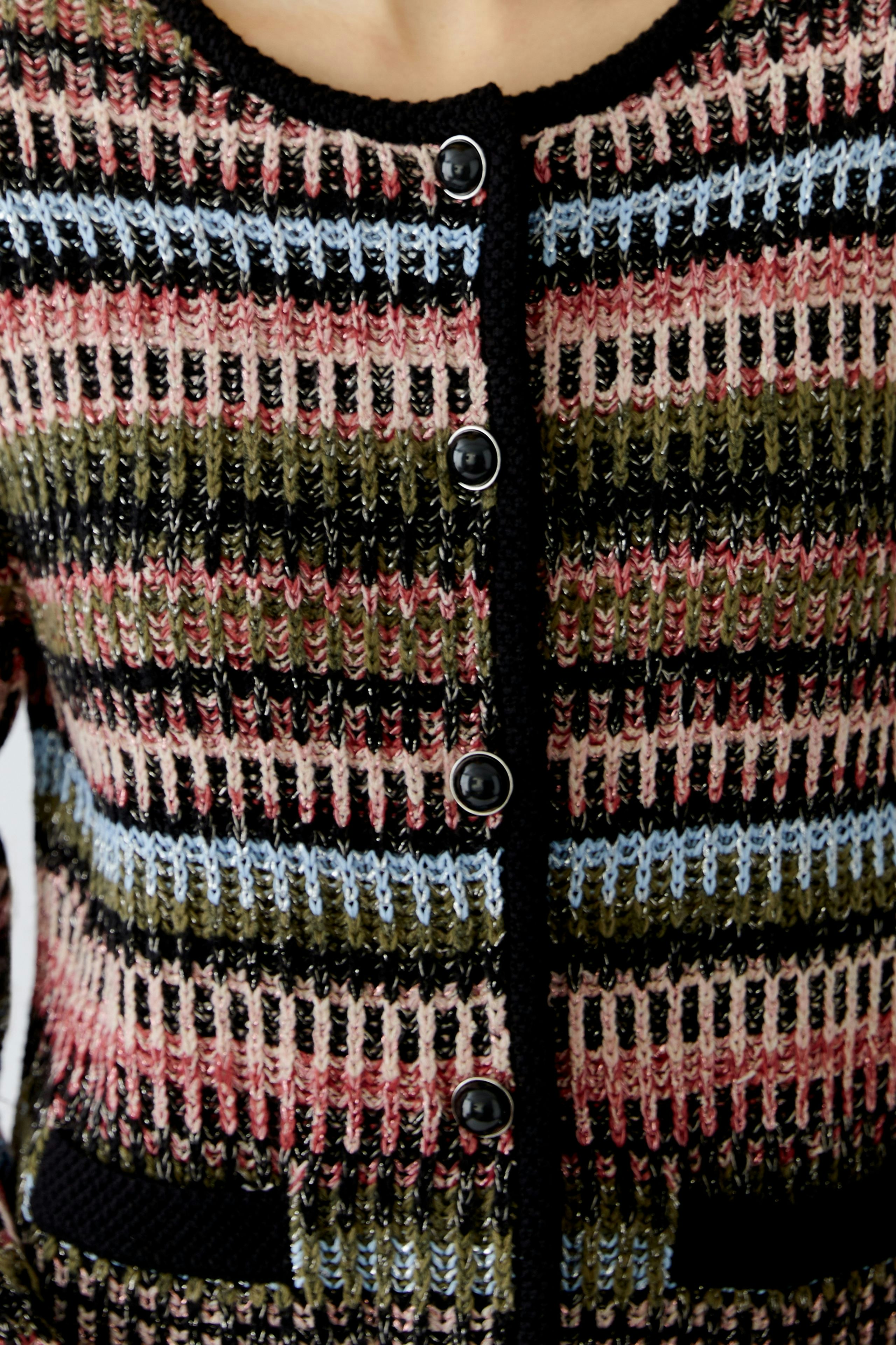 Colorful women's cardigan with buttons and pockets, featuring a striped pattern in various shades.