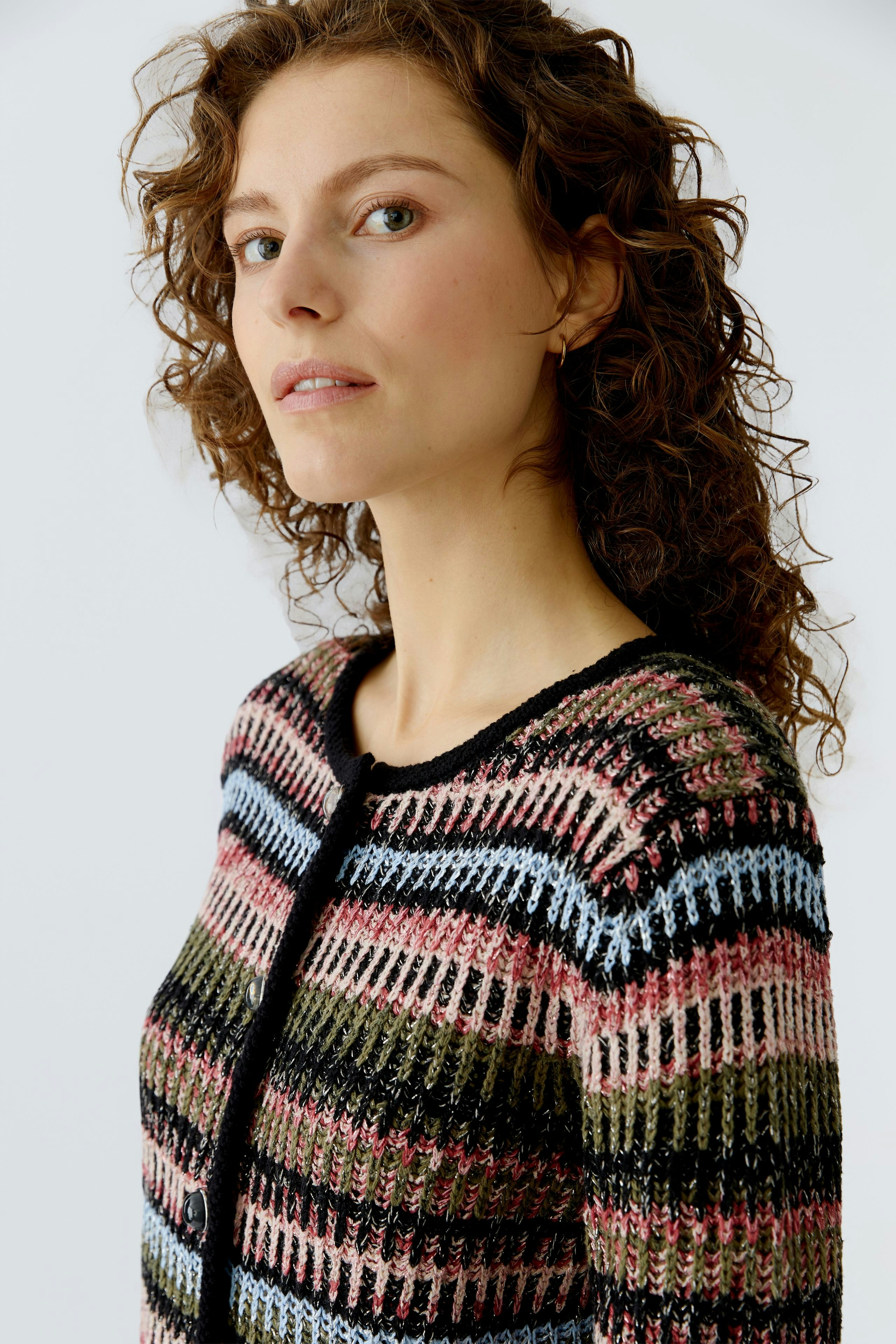 Colorful women's cardigan with a relaxed fit, featuring a striped pattern and button closure.