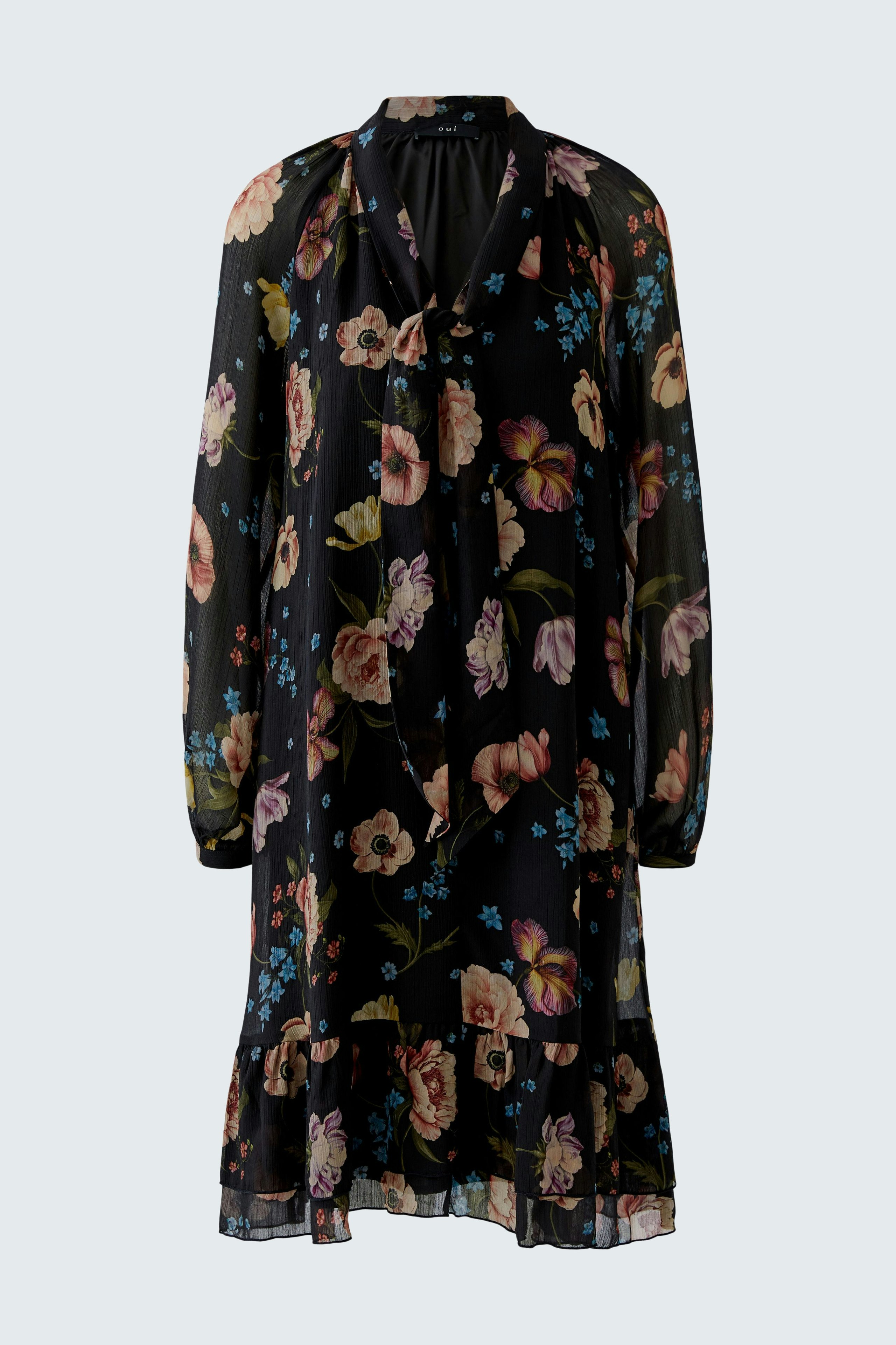 A-line dress: A woman in a floral dress with long sleeves and a relaxed fit, perfect for casual outings.