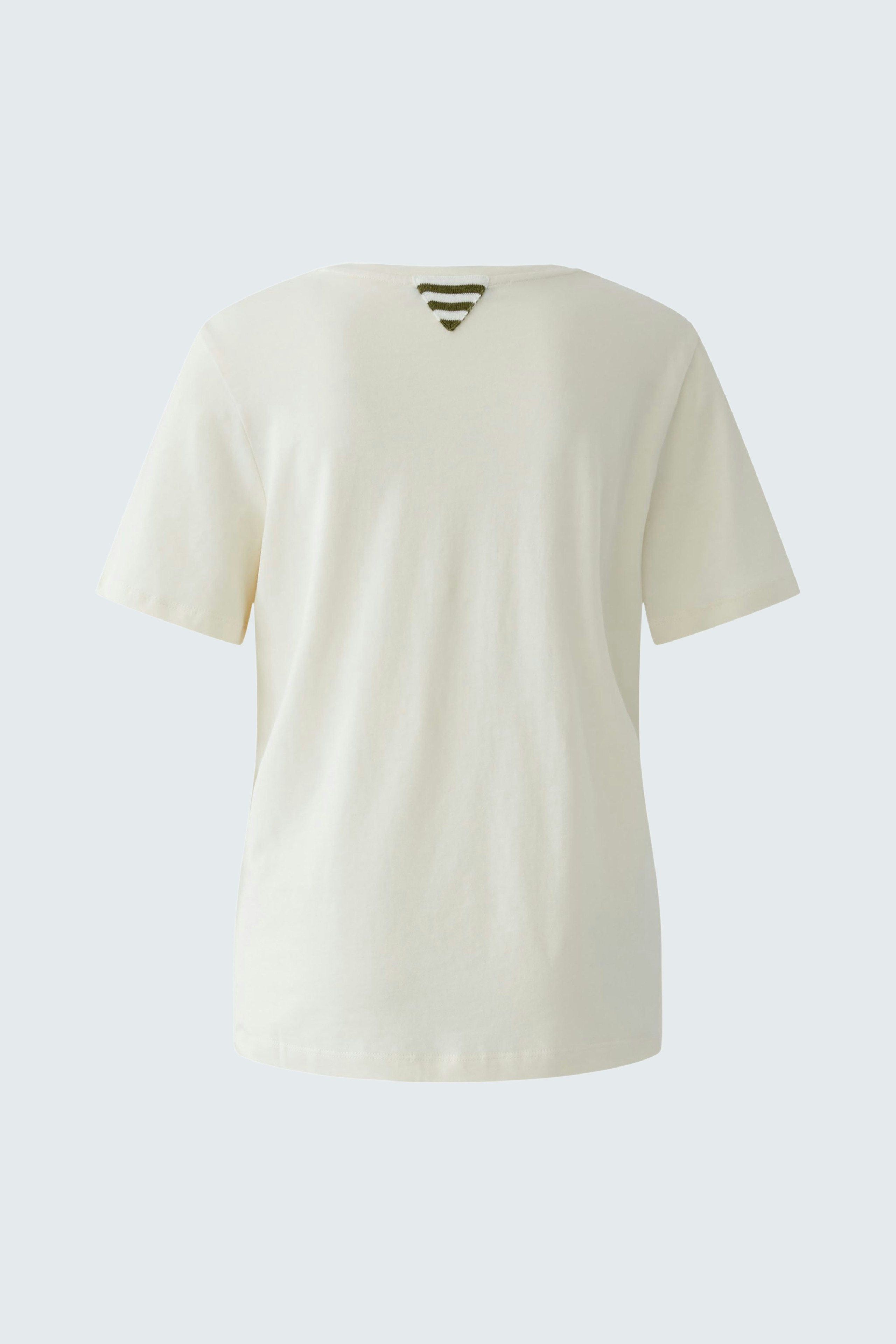 Casual women's T-shirt: A simple cream top with a relaxed fit and a unique back design.