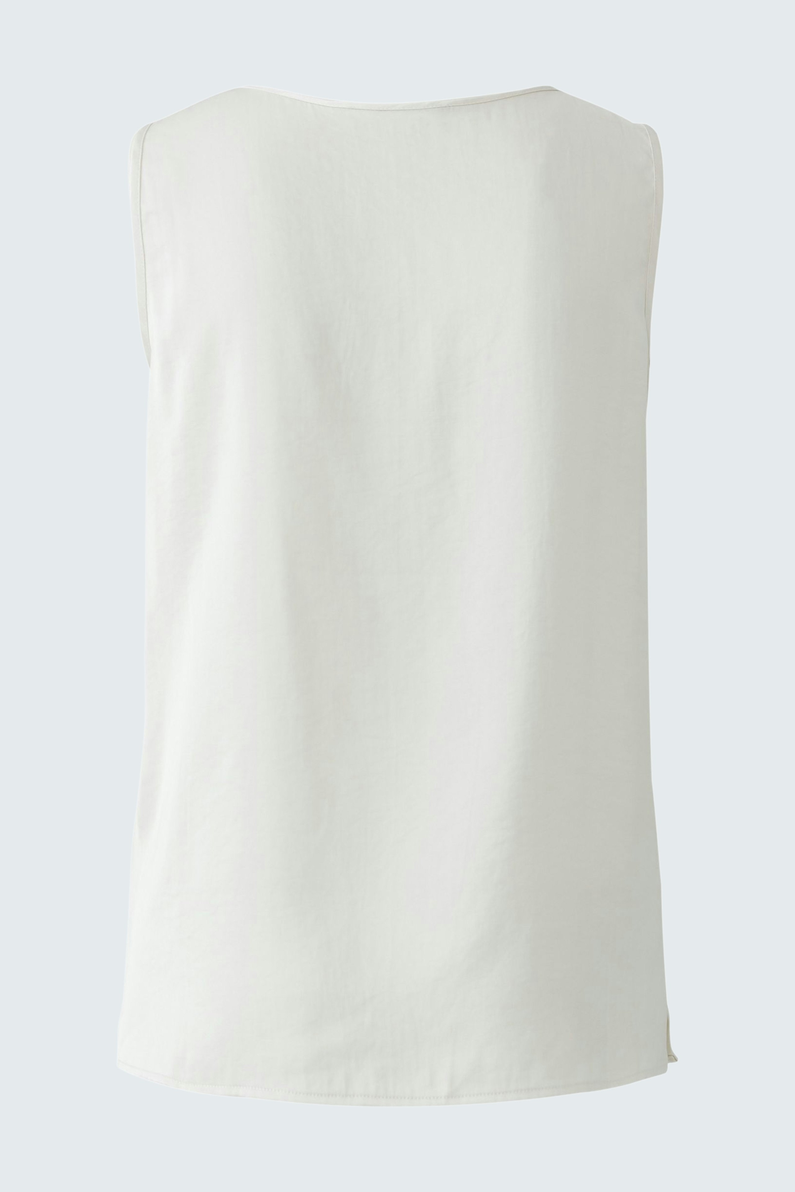 Casual women's top: A simple white sleeveless top, perfect for warm days.