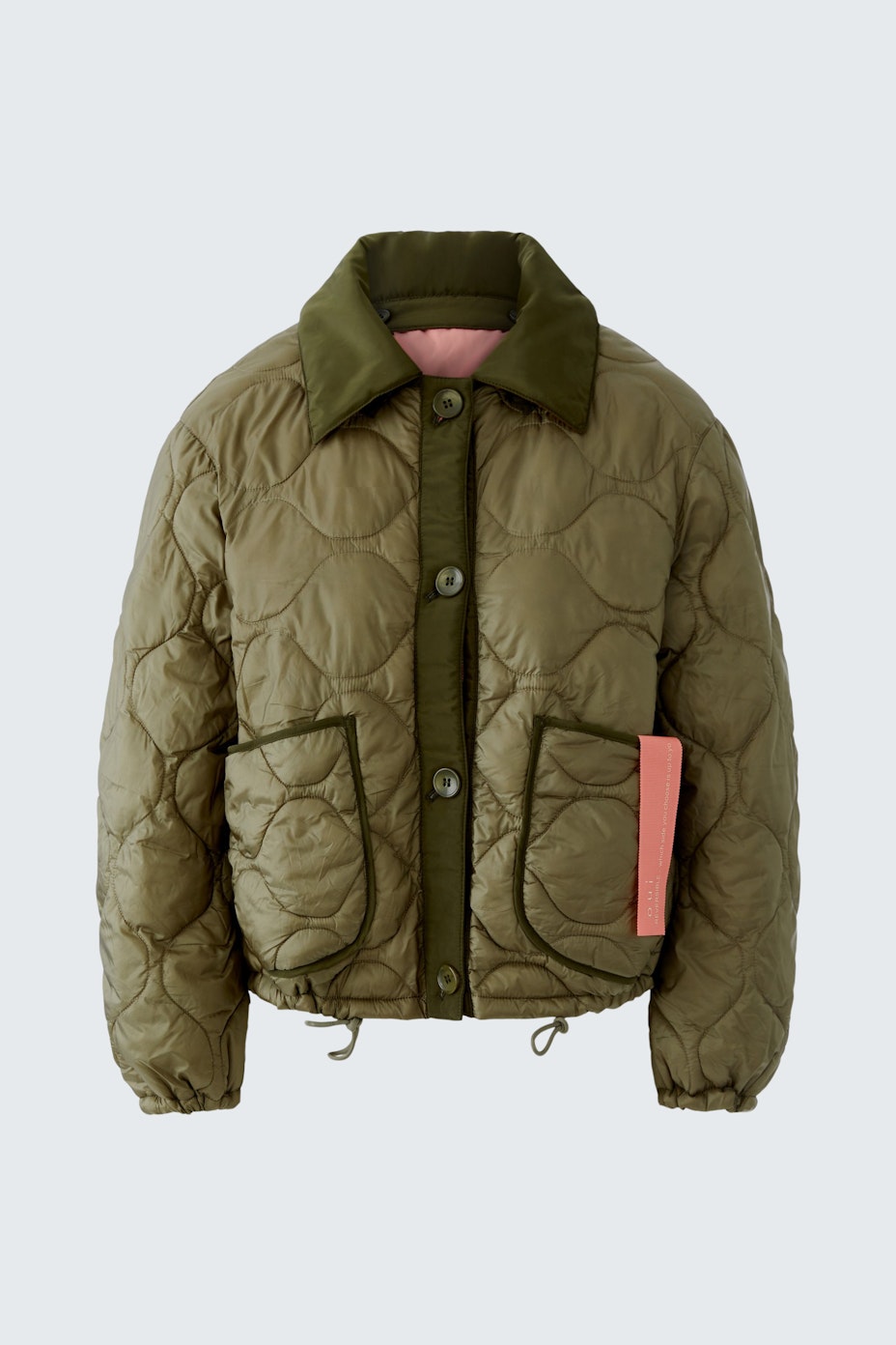 Reversible jacket: A stylish women's jacket in olive green with a quilted design and contrasting pockets.