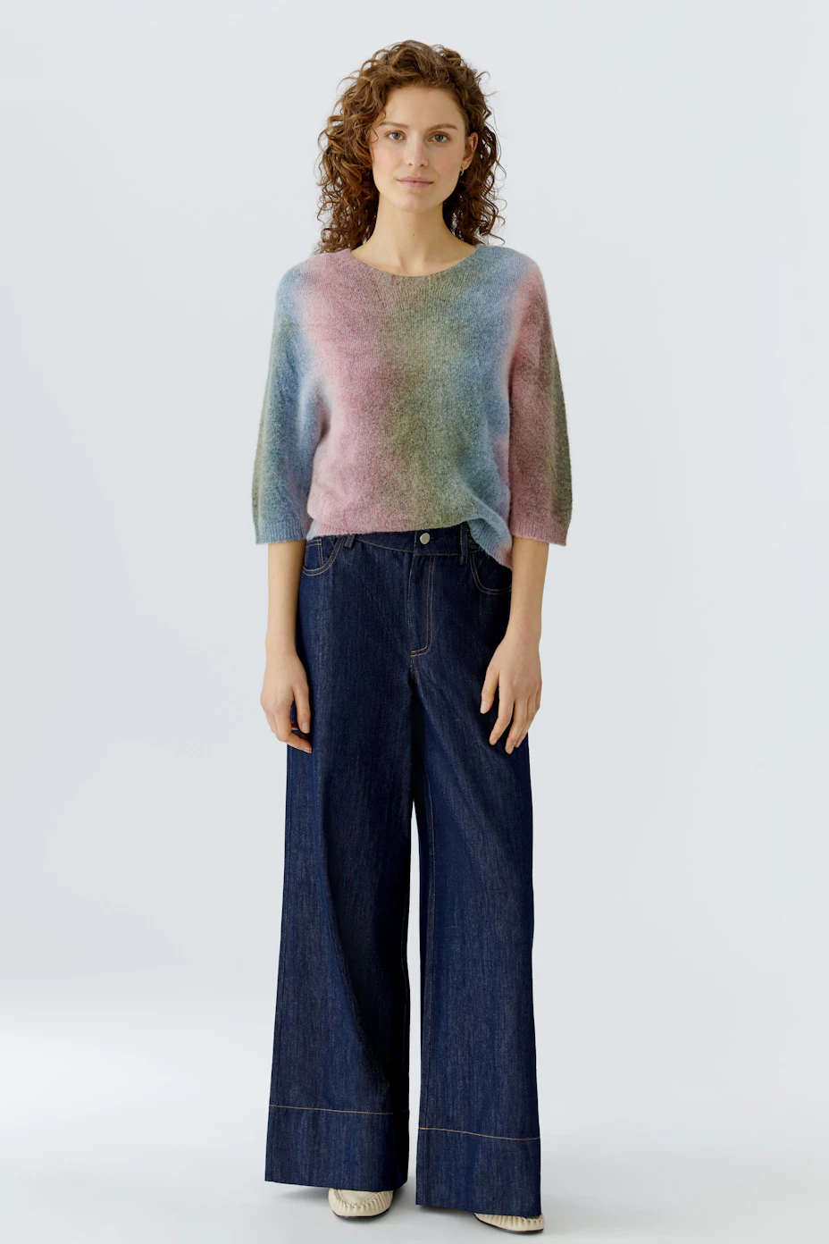 Colorful women's pullover with a relaxed fit and three-quarter sleeves, perfect for casual wear.