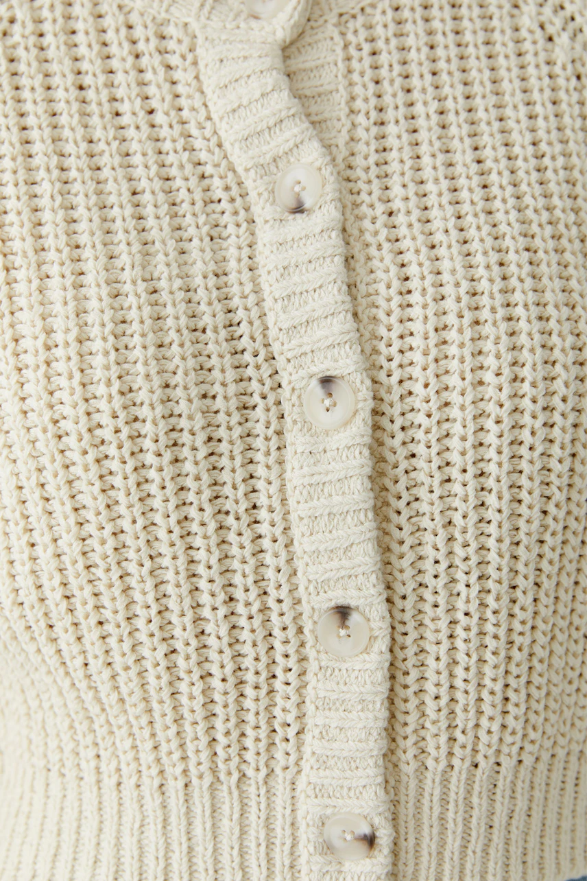 Lightweight women's cardigan with button closure, perfect for layering in casual outfits.