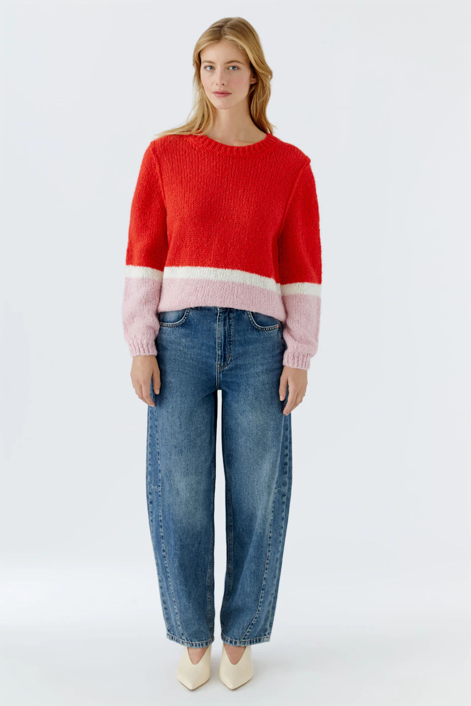 Cozy women's pullover in red and pink with a relaxed fit, perfect for casual outings.