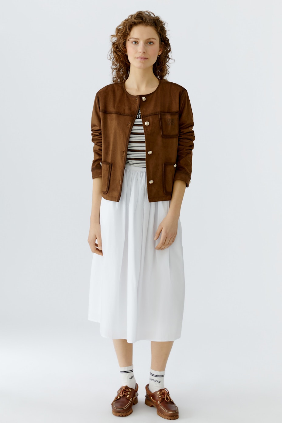 Brown faux leather jacket: A stylish women's jacket with pockets and button details.