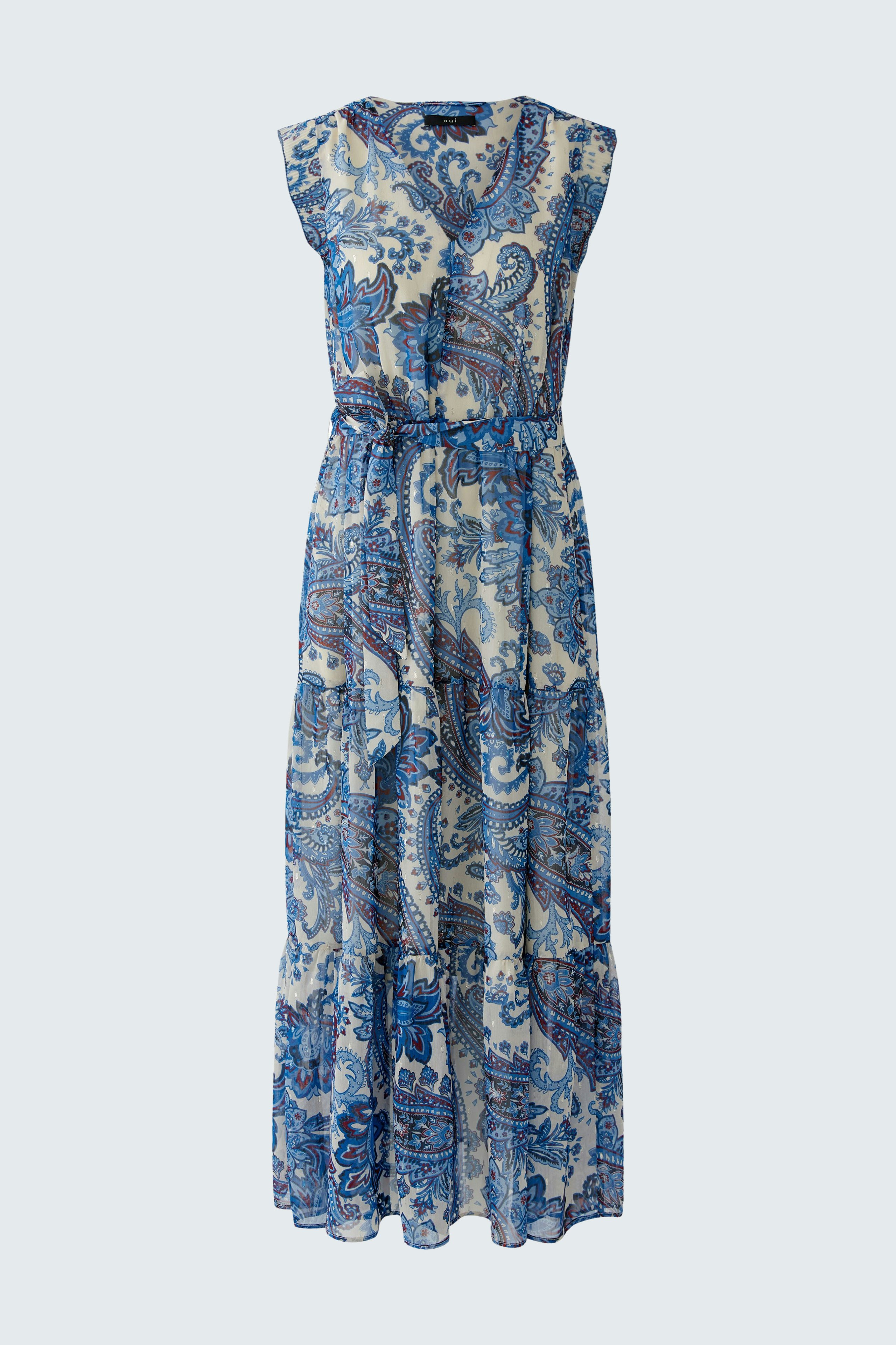 Maxi dress: A woman in a blue patterned maxi dress with a relaxed fit and flowing silhouette.