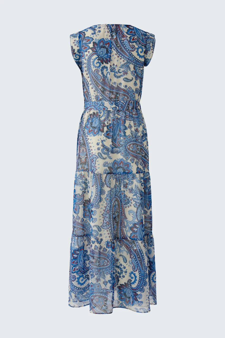 Maxi dress: A woman in a blue paisley-patterned maxi dress with a flowing silhouette.