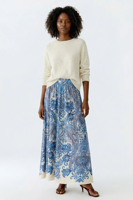 A-line skirt: A woman in a blue patterned skirt, flowing and comfortable for everyday wear.