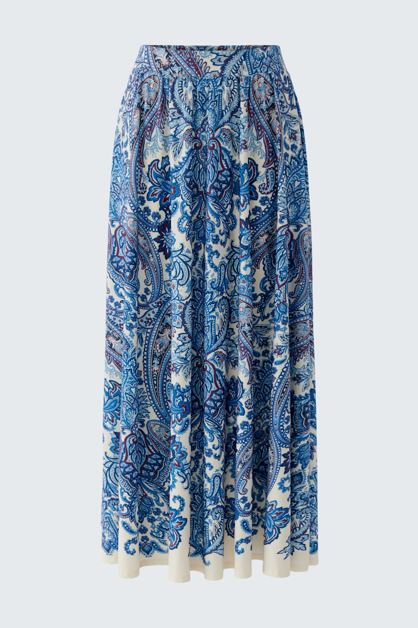 A-line skirt: A woman in a blue patterned skirt, flowing and comfortable for everyday wear.