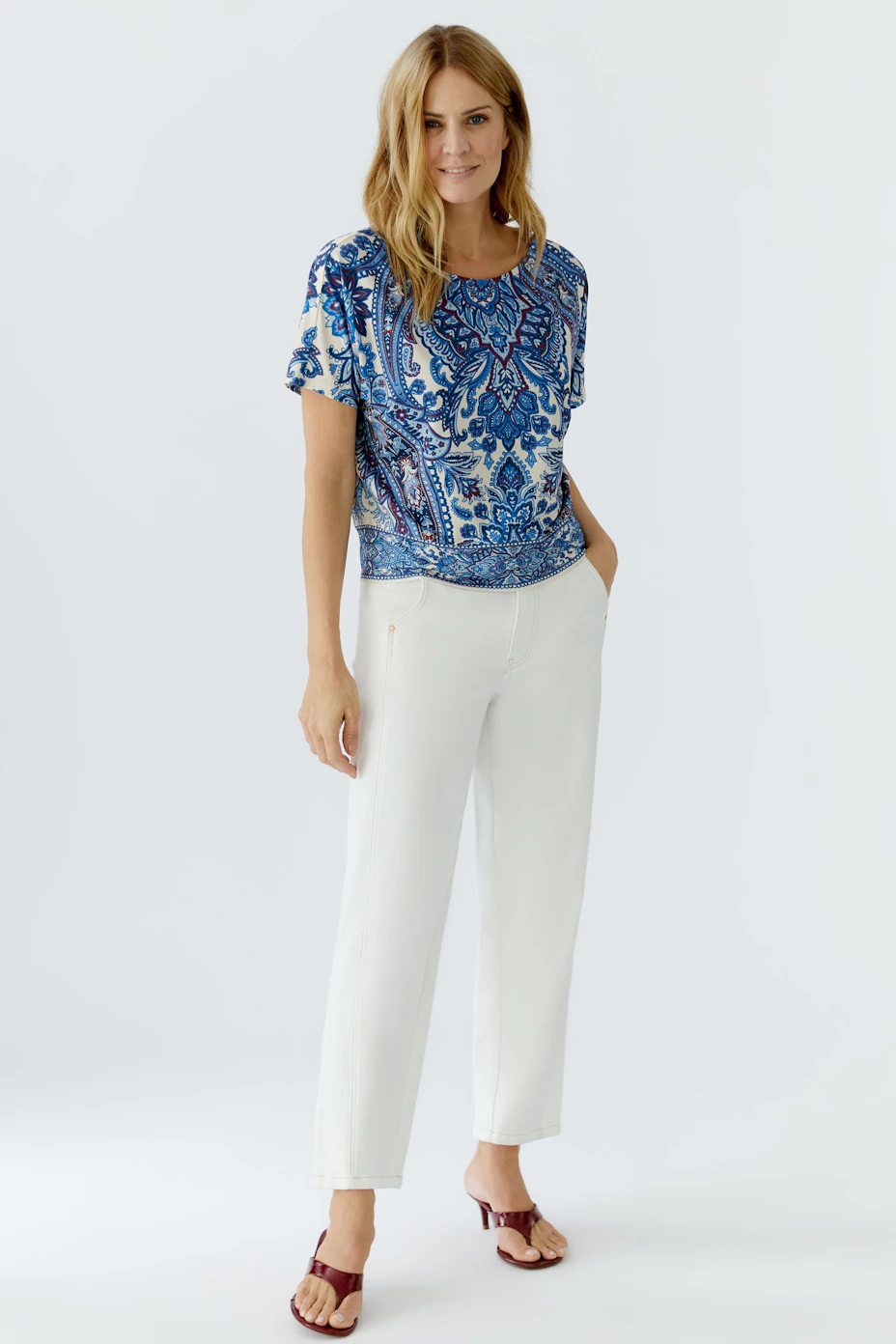 Stylish women's blouse shirt in blue and white floral pattern, featuring a relaxed fit.