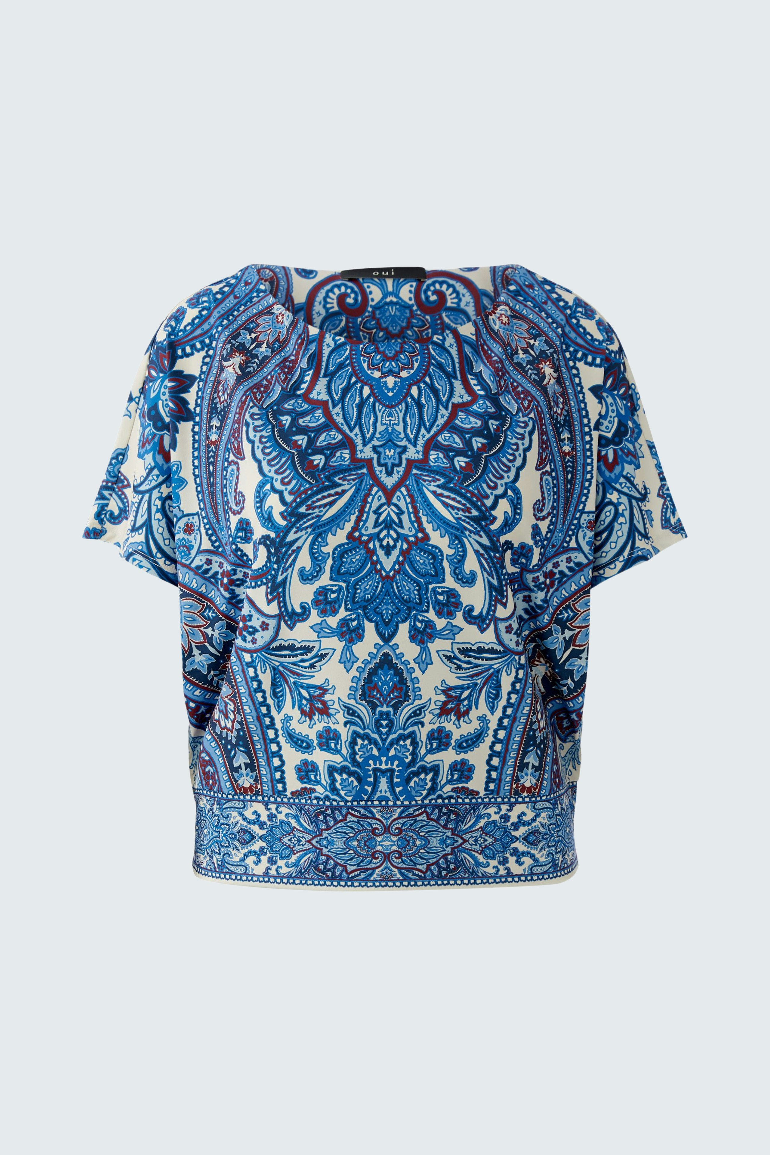 Stylish women's blouse shirt in blue and white floral pattern, featuring a relaxed fit.