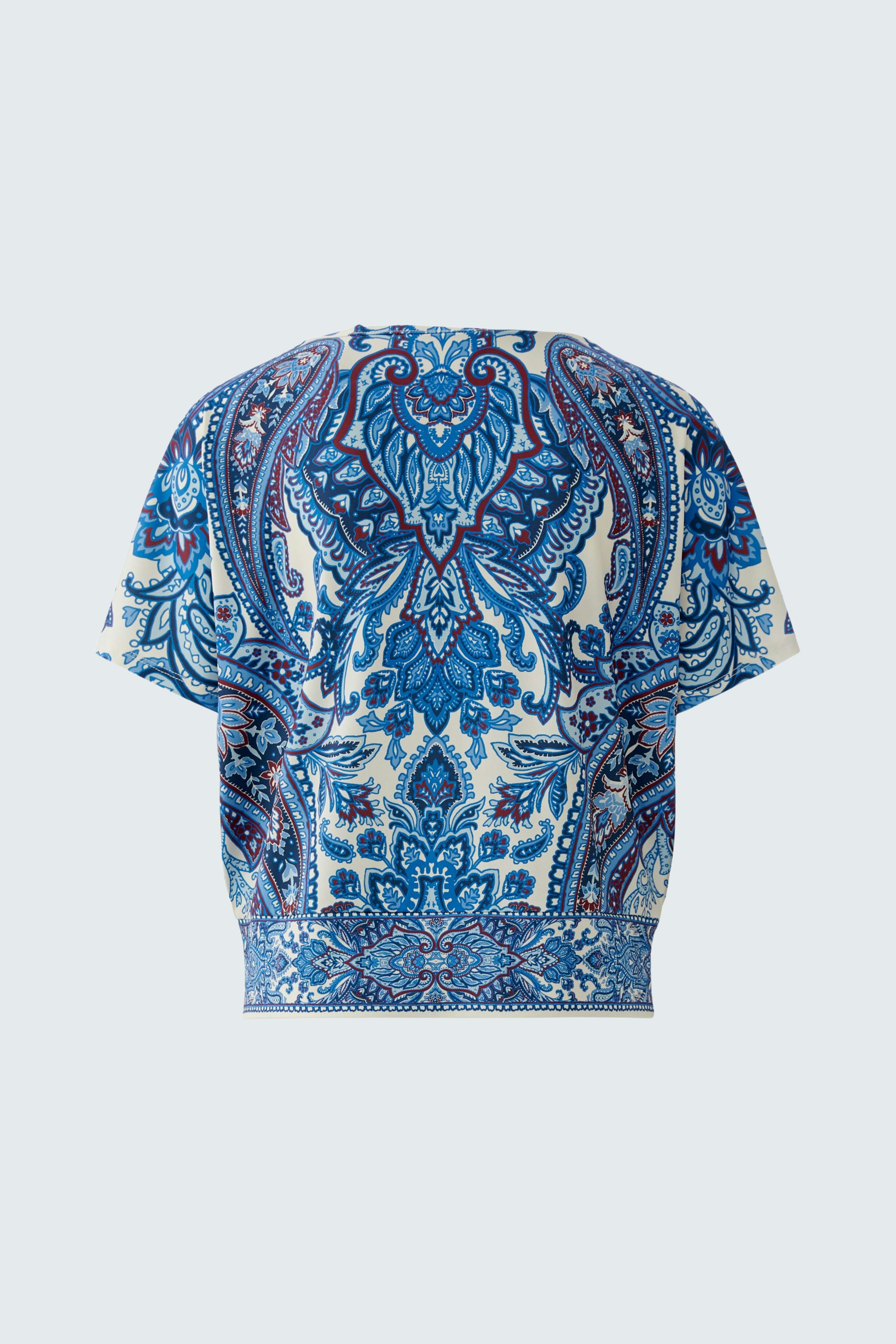 Stylish women's blouse shirt in a vibrant blue pattern, perfect for casual wear.