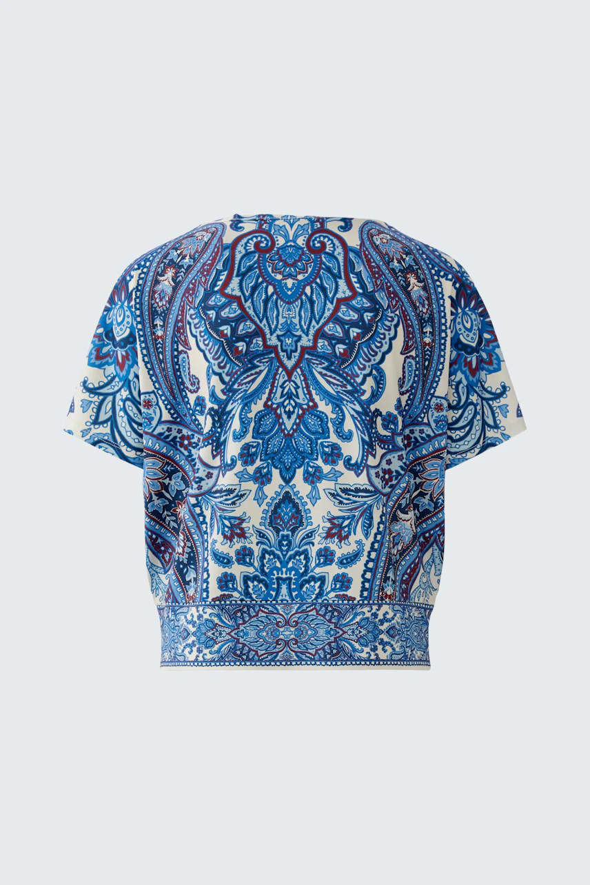 Stylish women's blouse shirt in a vibrant blue pattern, perfect for casual wear.