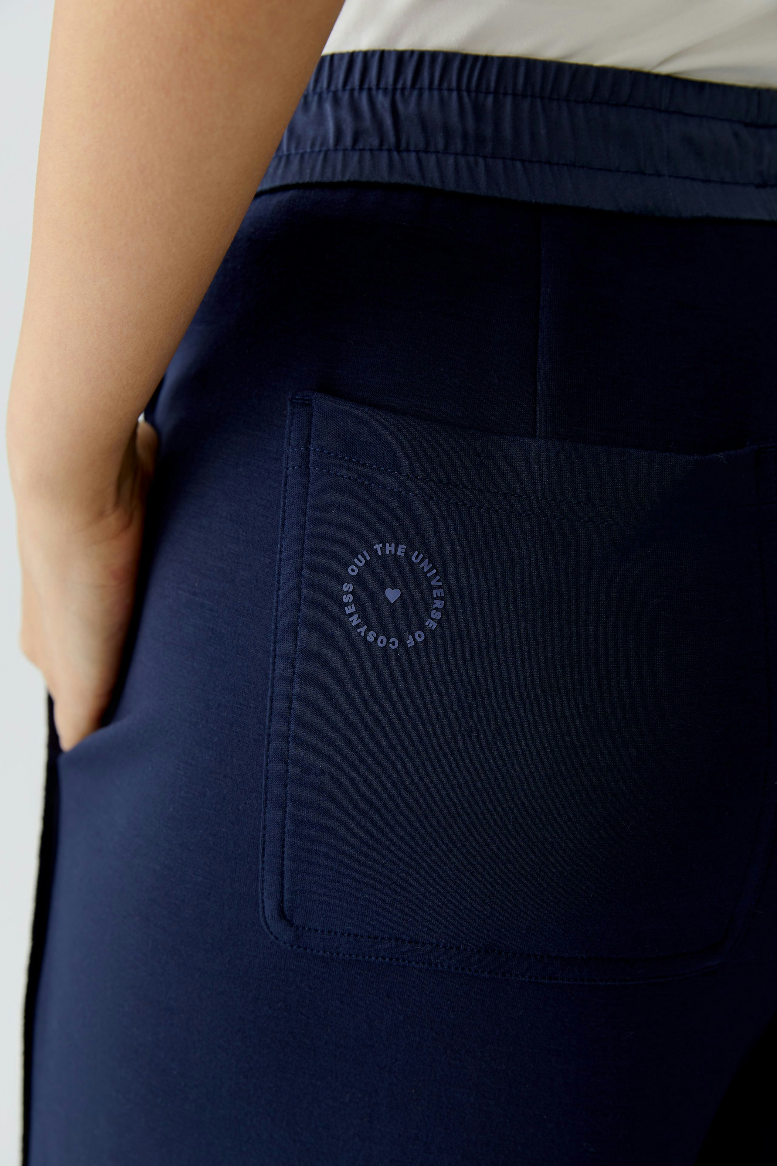 Comfortable women's sweatpants with a relaxed fit and a back pocket detail.