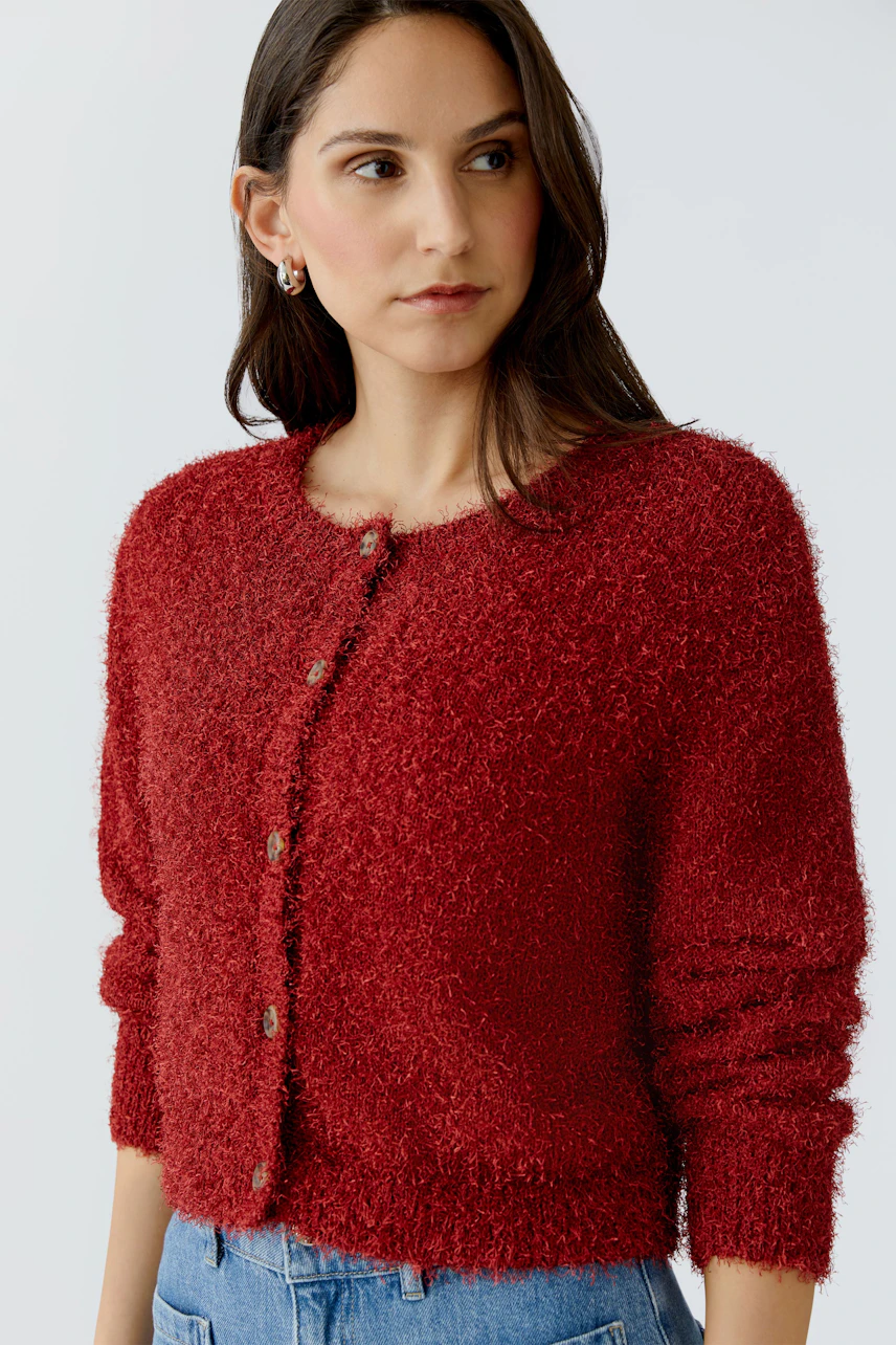 Cozy women's cardigan in red with a round neck and button closure, perfect for layering.