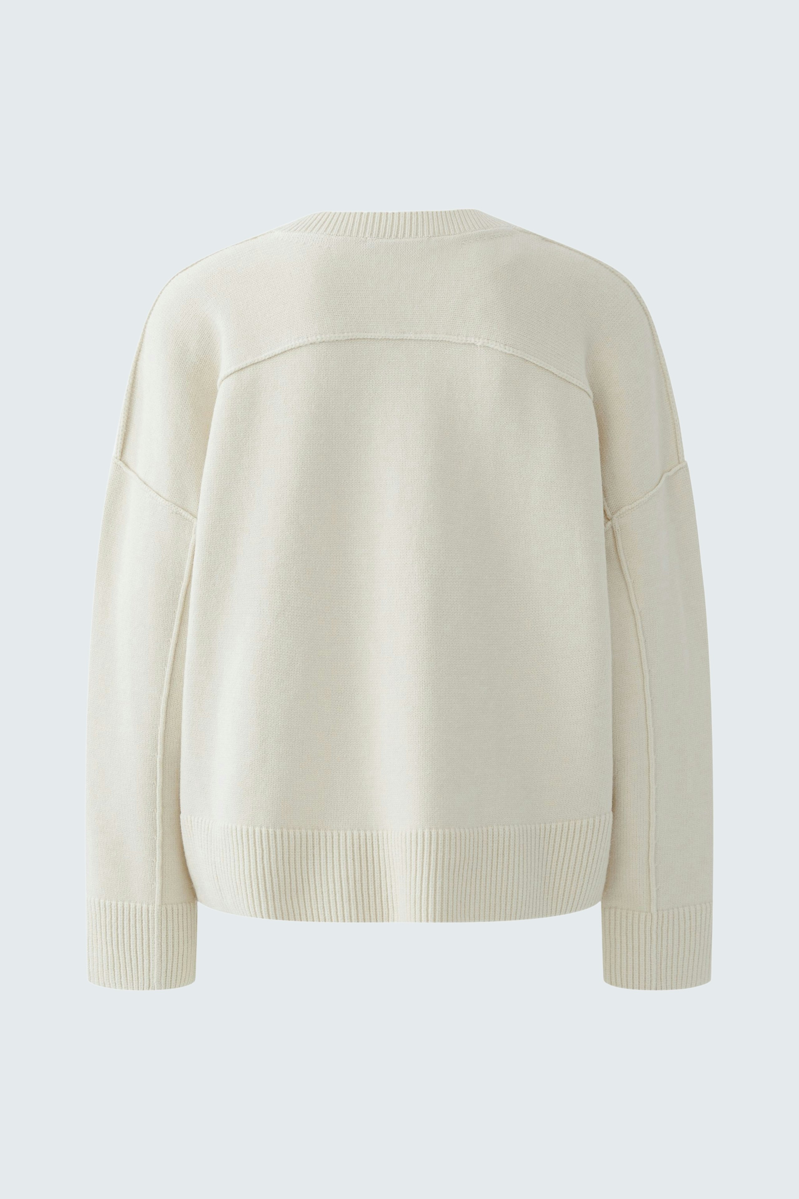 Casual women's pullover: Back view of a soft cream pullover with a relaxed fit and ribbed hem.