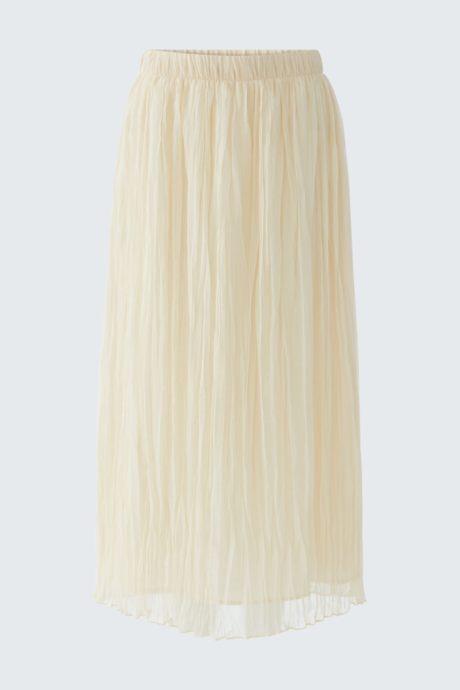 Light pleated skirt: A woman in a flowing, cream-colored pleated skirt, perfect for casual wear.