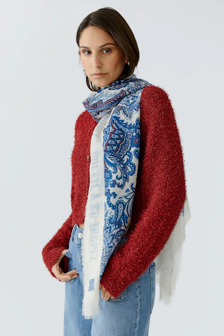 Lightweight scarf with blue floral patterns, perfect for adding a touch of style to any outfit.