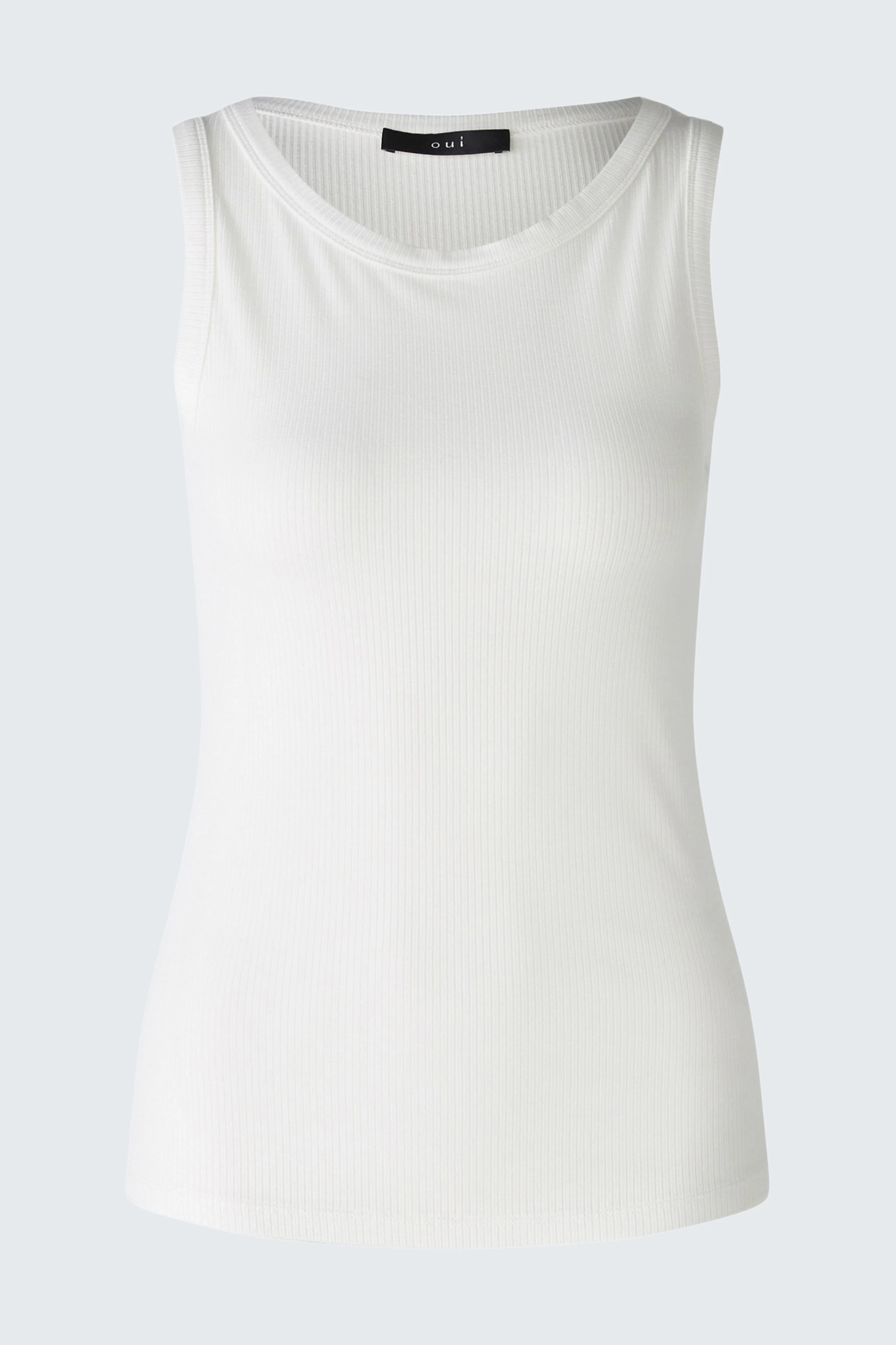 White sleeveless top: Simple and versatile, perfect for layering or wearing alone.