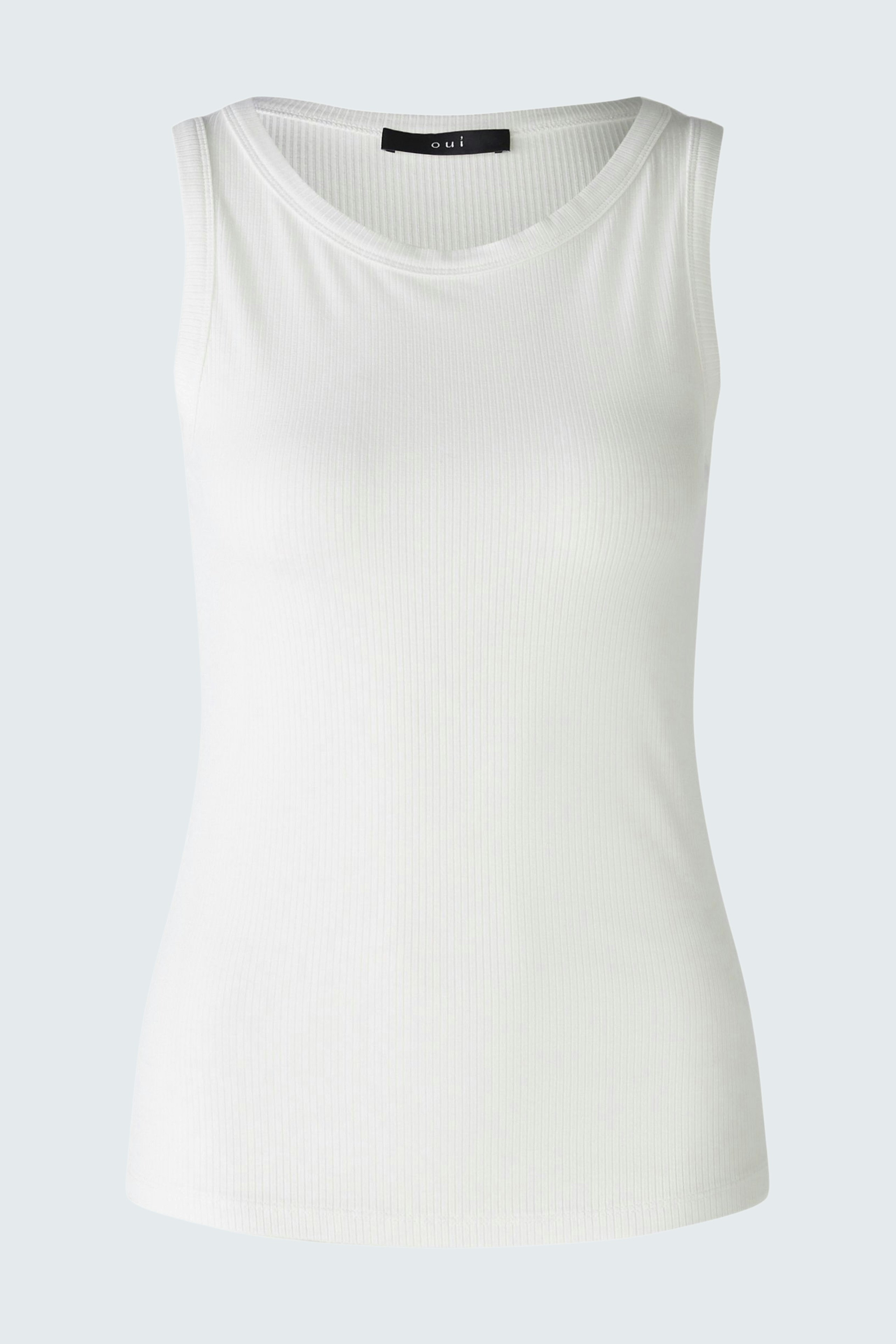 White sleeveless top: Simple and versatile, perfect for layering or wearing alone.