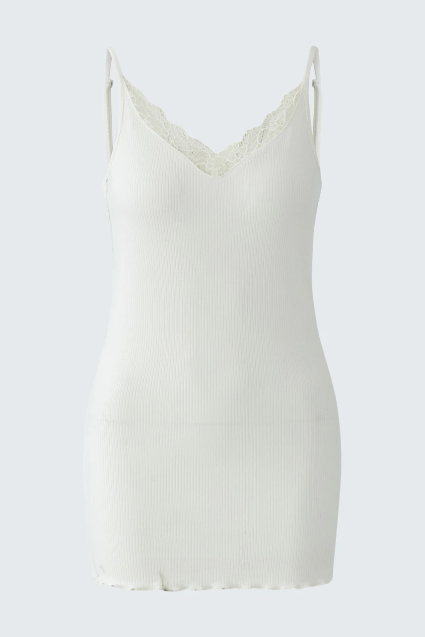 White women's top with lace trim, sleeveless and fitted. Ideal for layering or wearing alone.