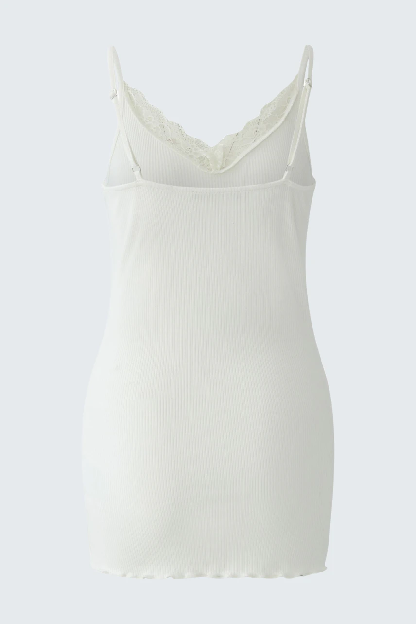 White women's top: Sleeveless, lace-trimmed, perfect for layering or wearing alone.