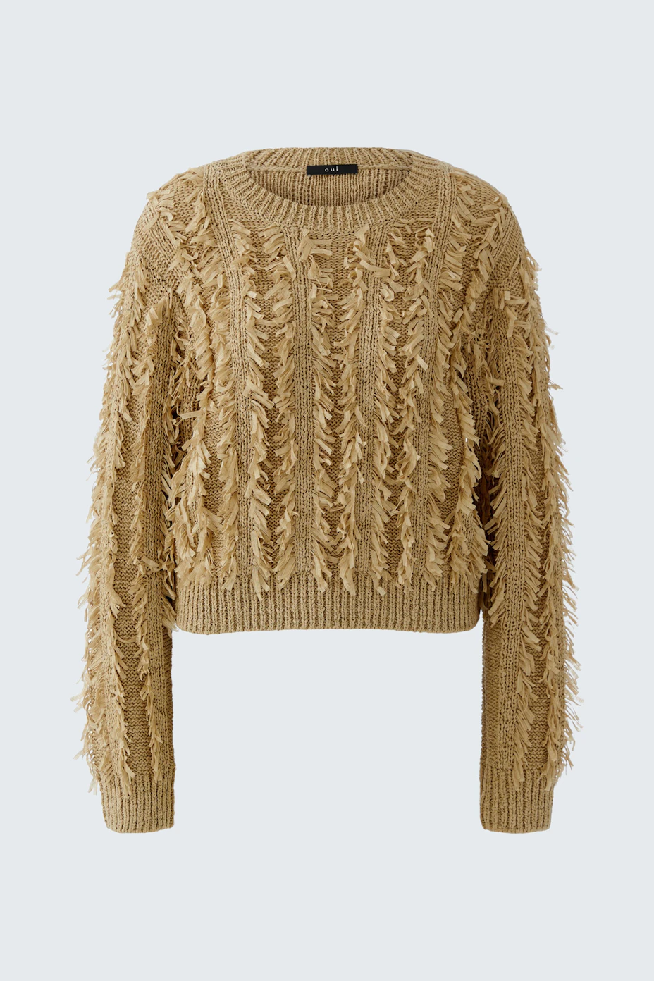 Textured beige pullover with fringe details, perfect for a cozy and stylish look.