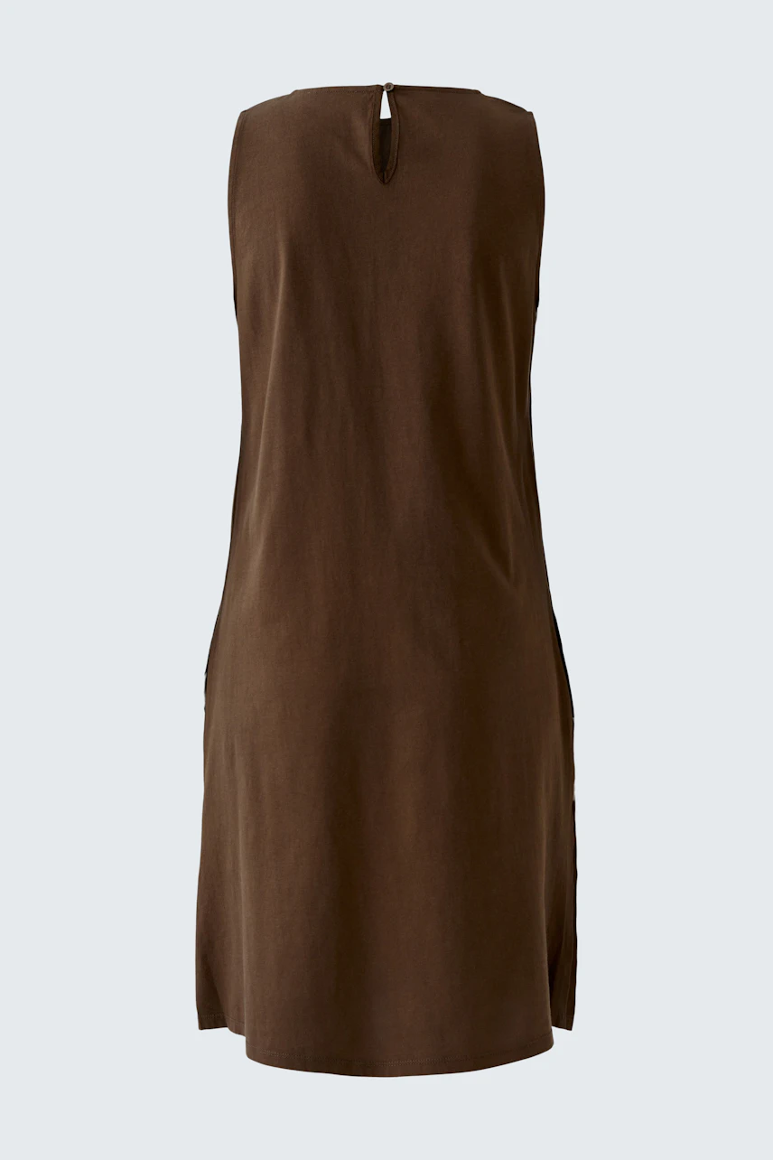 Casual A-line dress: A woman in a brown sleeveless dress with a keyhole back, perfect for warm days.
