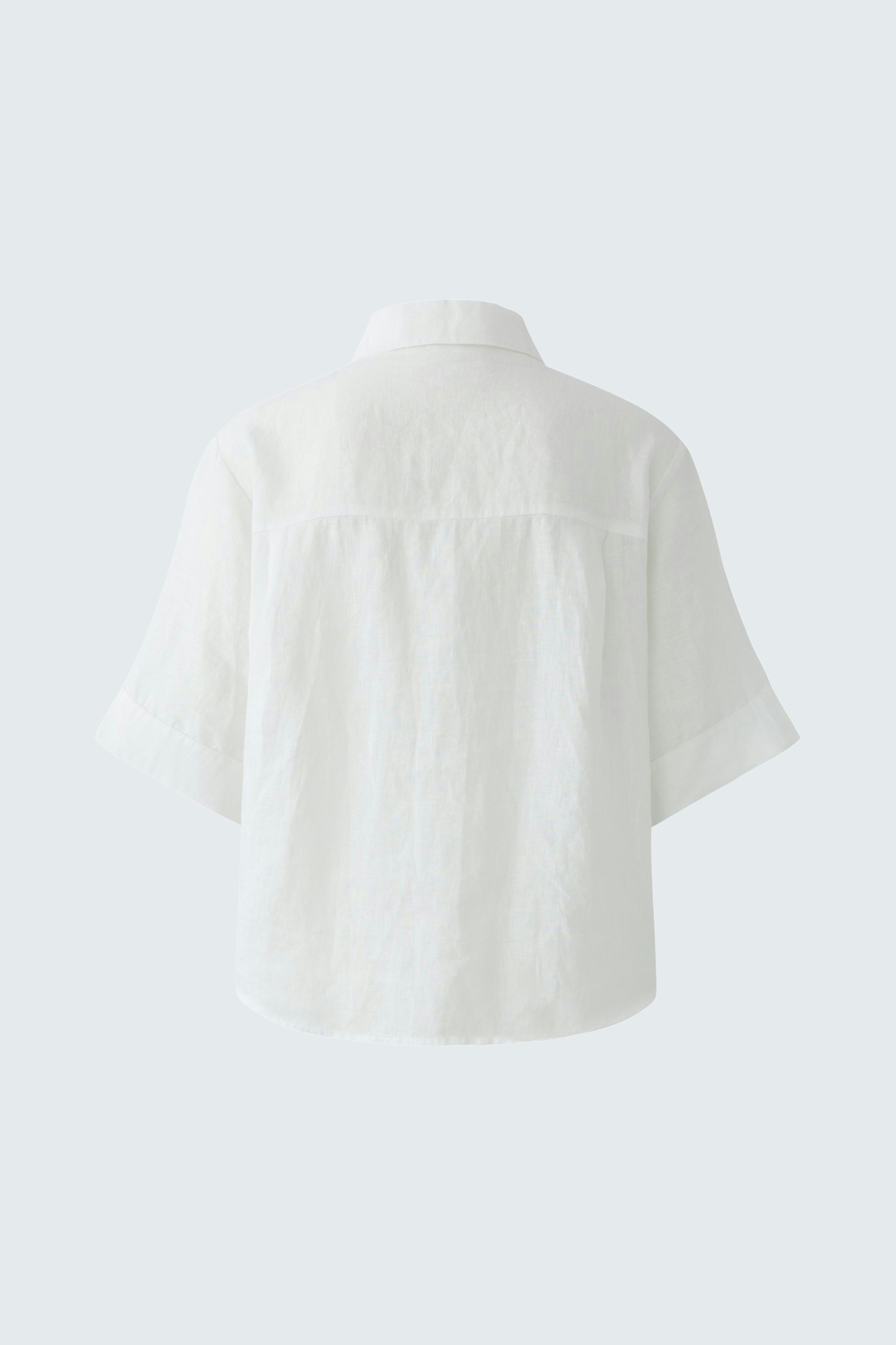 Casual women's blouse: Back view of a loose-fitting white blouse with short sleeves.