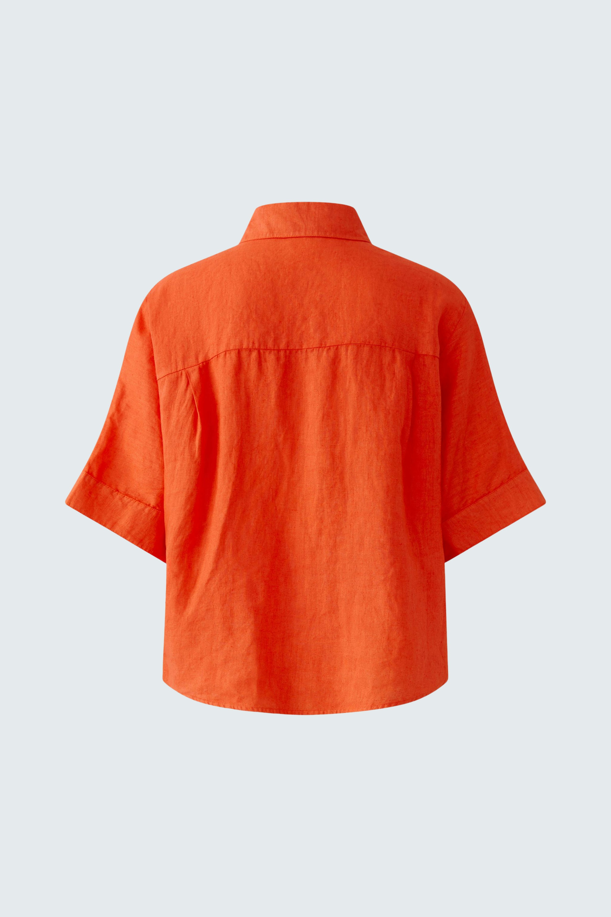 Casual women's blouse: Back view of a loose-fitting orange blouse with short sleeves.