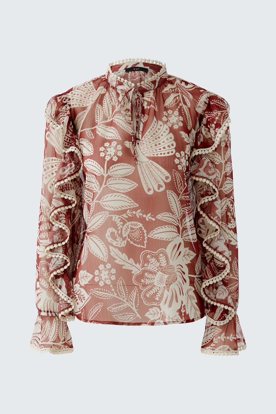 Damen-Bluse mit floralem Muster und Rüschenärmeln in sanften Farben.