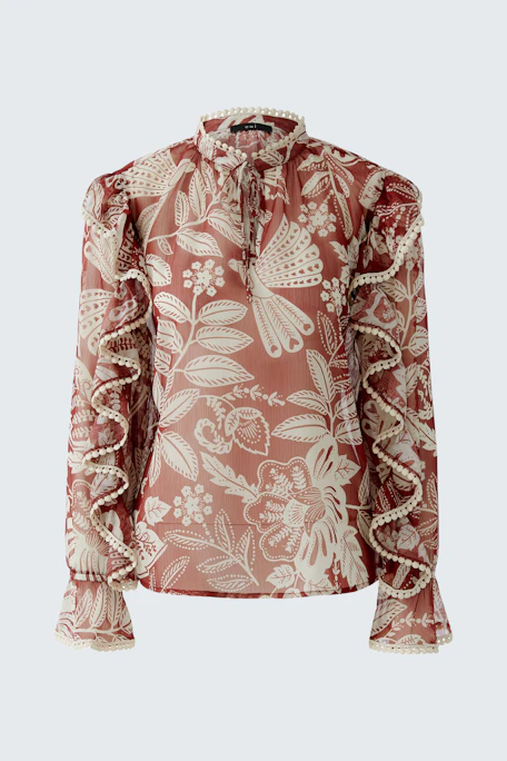 Floral blouse: A stylish women's blouse with ruffled sleeves and a vibrant floral pattern.