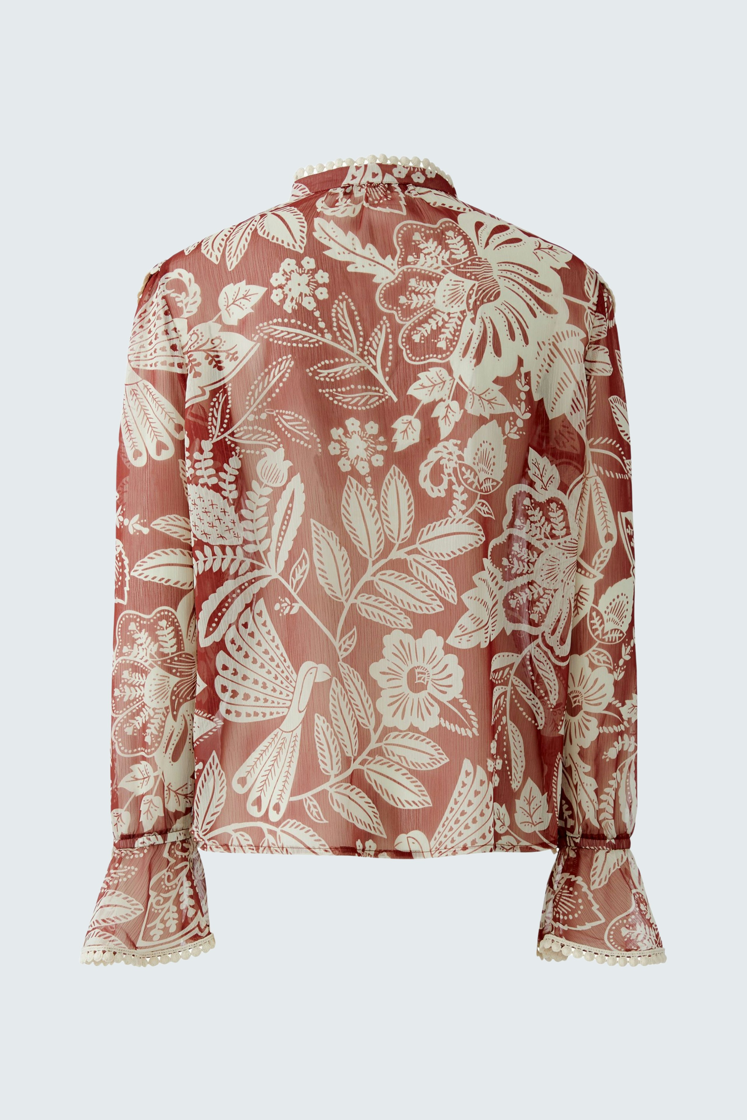 Damen-Bluse mit floralem Muster in sanften Farben, lässig geschnitten und mit langen Ärmeln.