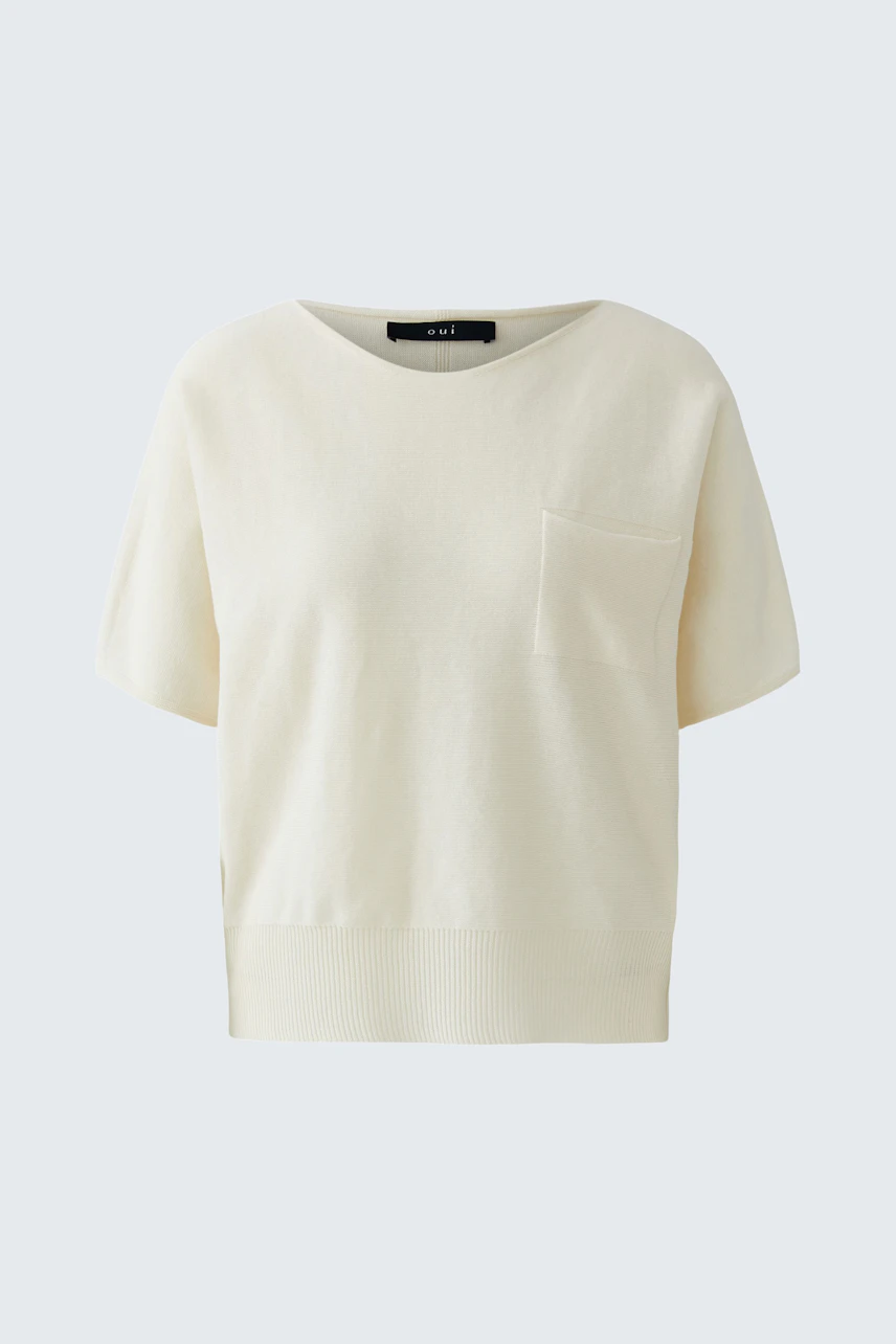 Casual women's pullover in soft cream color with short sleeves and a pocket detail.