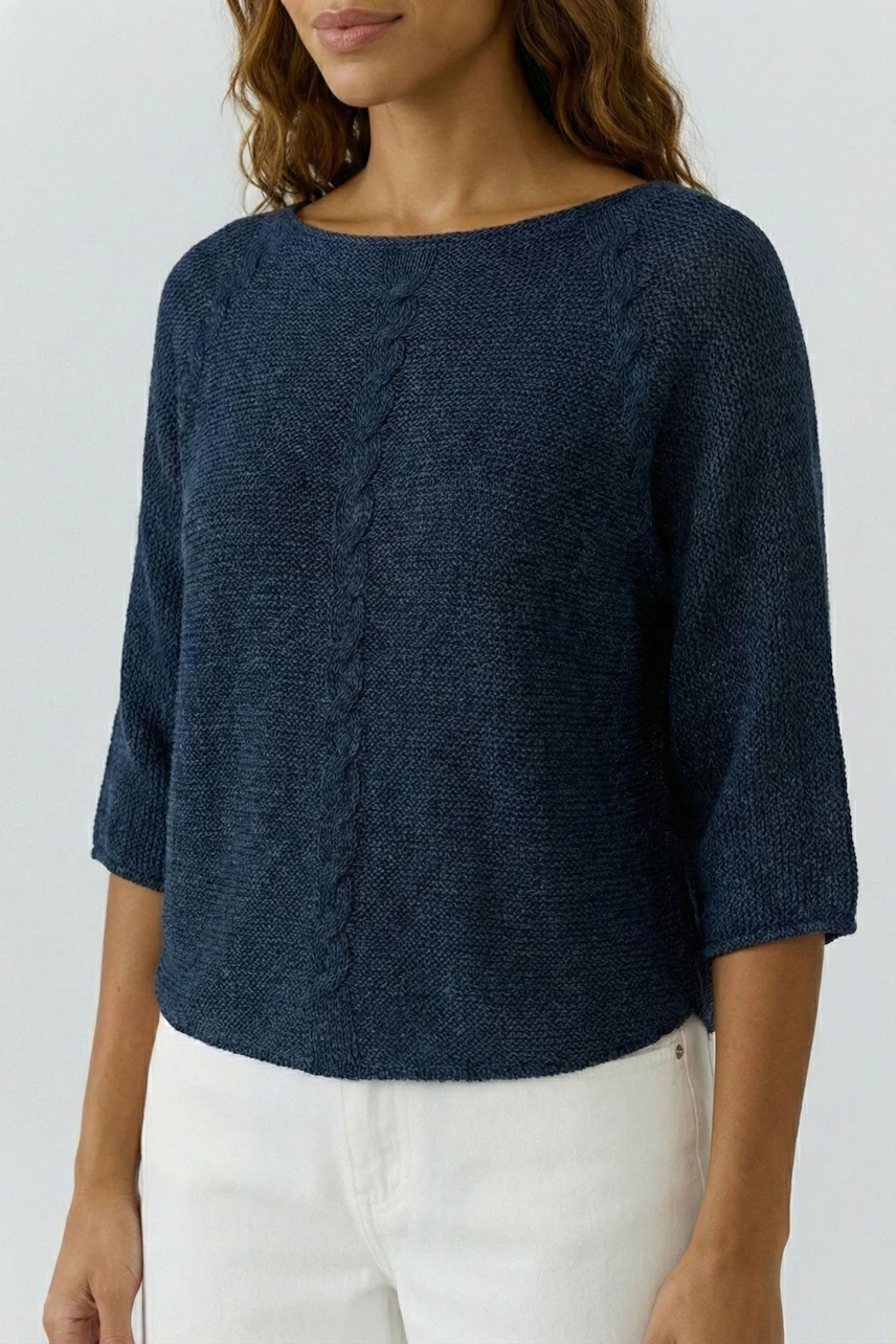 Casual women's pullover: Woman in a navy blue knitted pullover with three-quarter sleeves.