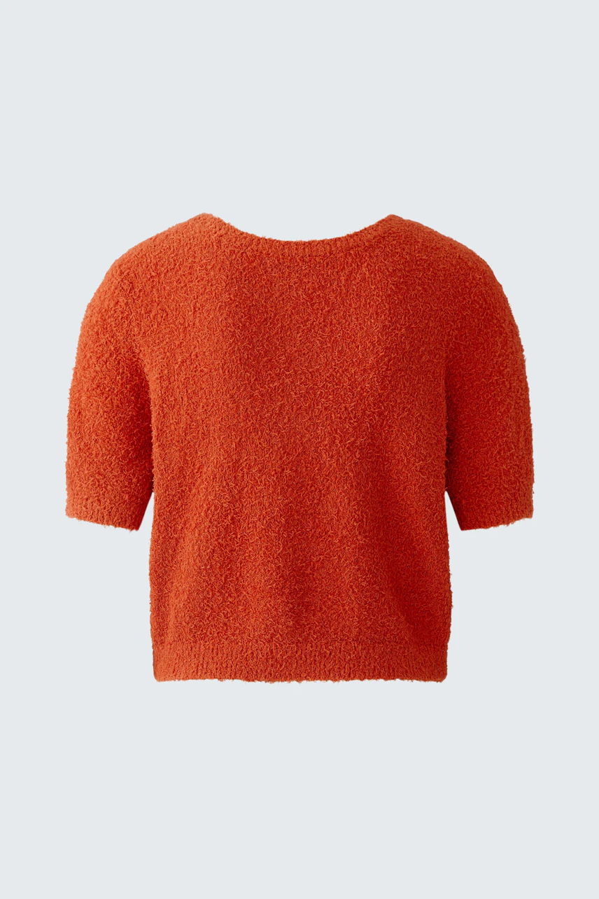 Cozy women's pullover in vibrant orange, featuring a relaxed fit and short sleeves.