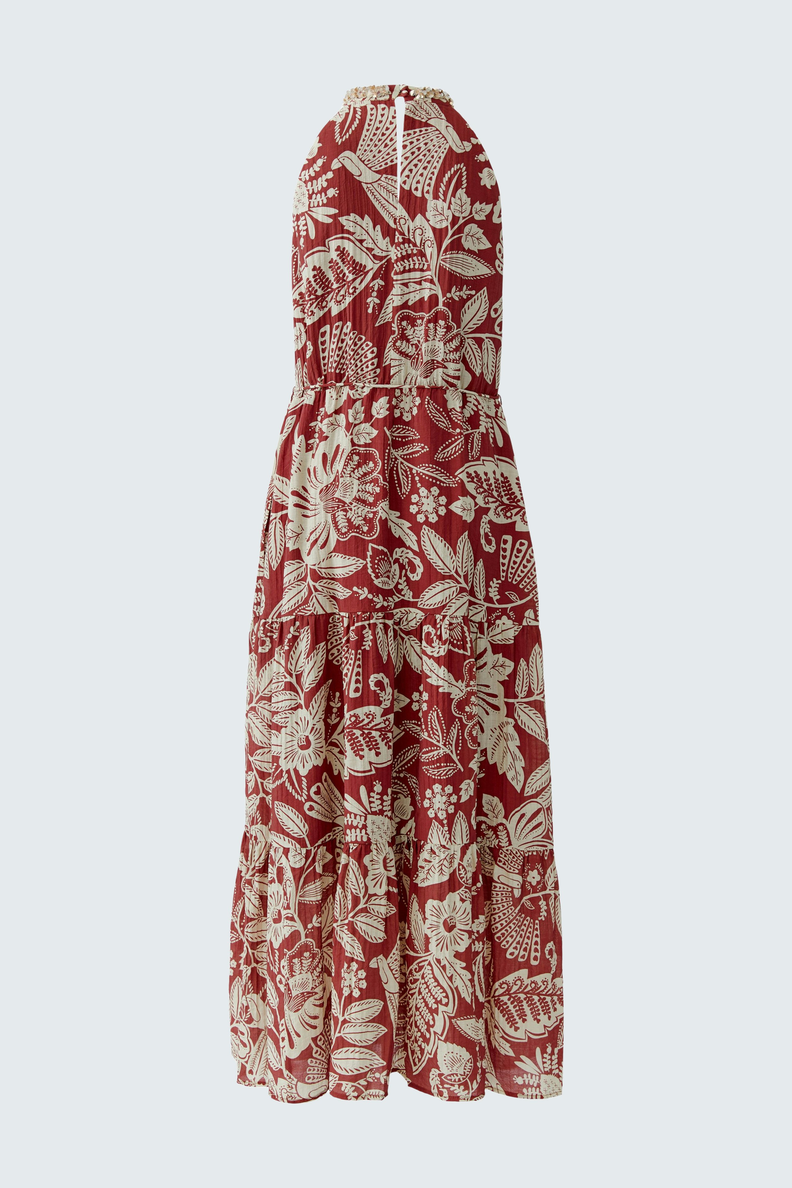 Floral maxi dress: Sleeveless red and white patterned dress with a flowing silhouette.